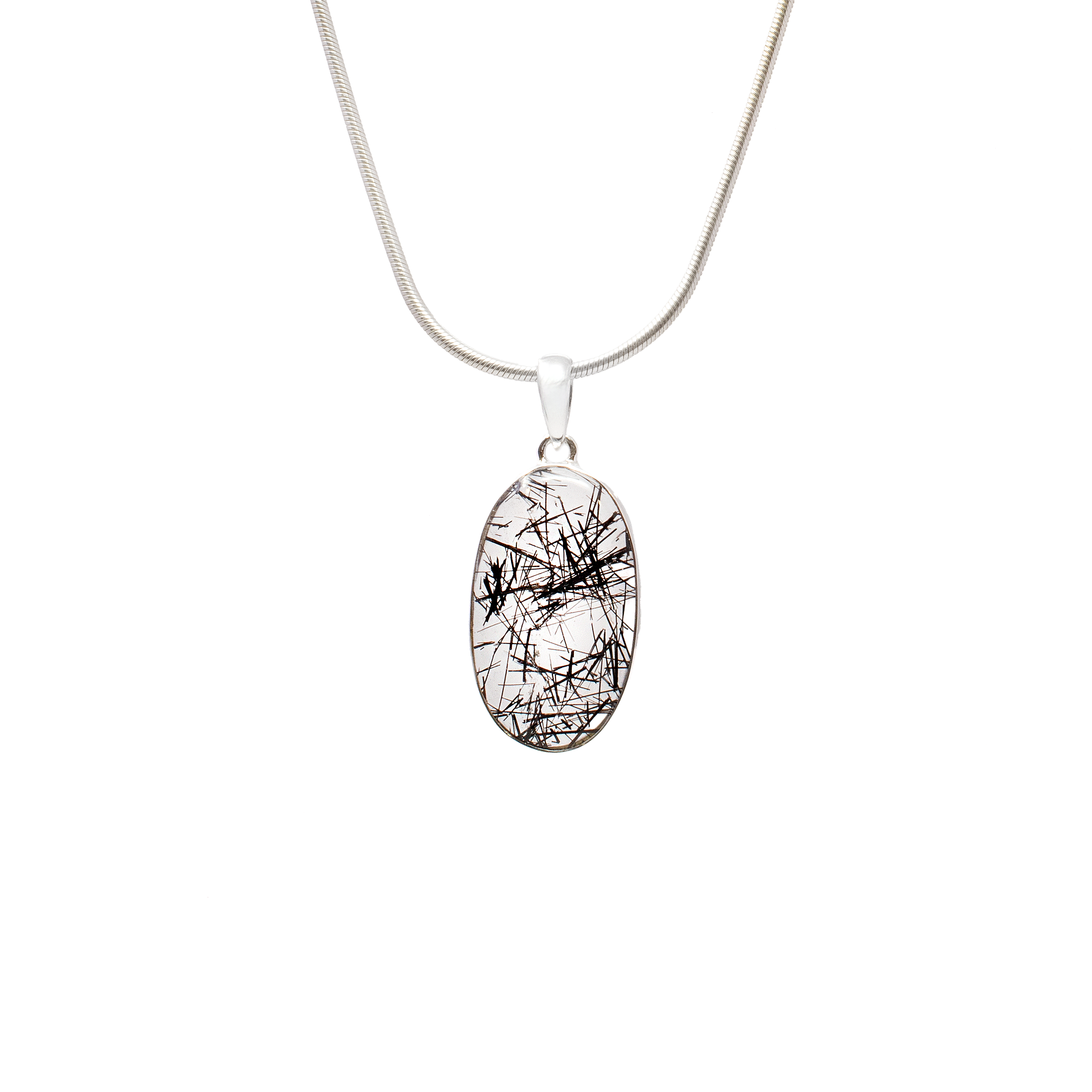 Elevate your jewelry collection with the exquisite Black Tourmaline Rutile Pendant, a piece that combines timeless elegance with natural splendor. This stunning pendant features a classic oval cabochon showcasing exceptional high clarity and dense rutilation, making it a captivating addition to any ensemble.The pendant is gracefully set in a simple 925 sterling silver bezel that accentuates the natural beauty of the gemstone while ensuring durability and comfort for everyday wear. The sterling silver provides a gleaming contrast to the deep, rich tones of the black tourmaline, highlighting the intricate rutilated patterns that dance within the stone. The pendant boasts excellent transparency, allowing light to penetrate through the stone and amplify the unique rutiles.Chain Not Included. Black Tourmaline Rutile Pendant - Classic Oval Cabochon with Simple 925 Sterling Silver Bezel - High Clarity with Dense Rutilation
