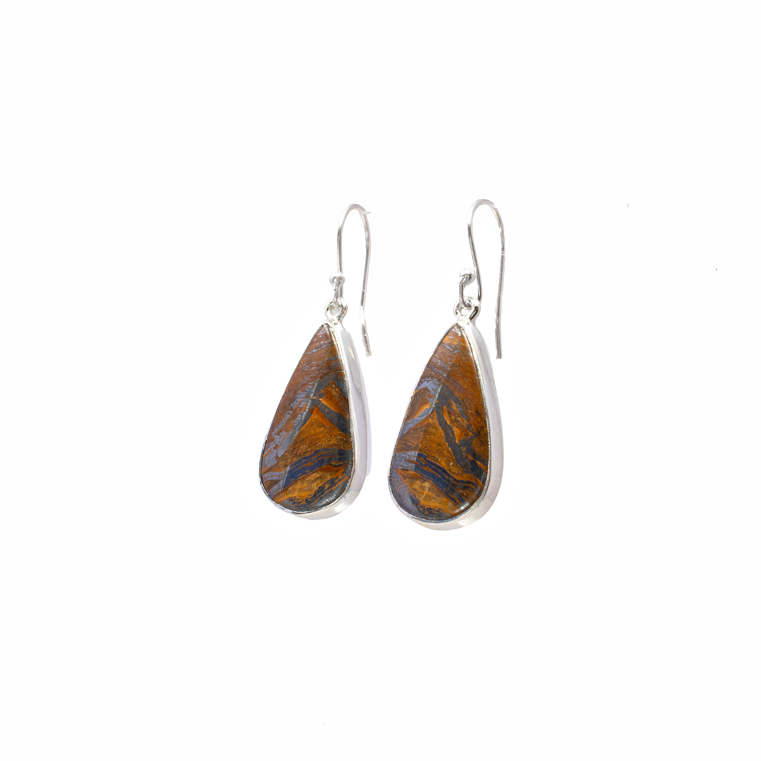 Elevate your jewelry collection with the mesmerizing allure of our Iron Tigers Eye Dangle Earrings. Featuring exquisite pear-shaped cabochons, these earrings are designed to captivate and enchant with every movement. Crafted from high-quality Iron Tigers Eye, each stone boasts unique patterns and rich hues, creating a one-of-a-kind piece that reflects both strength and beauty.The cabochons are delicately encased in a simple yet elegant 925 sterling silver bezel setting, providing a timeless backdrop that enhances the natural allure of the gemstones. The sterling silver not only ensures durability but also adds a touch of sophistication to these stunning dangle earrings.Whether you're dressing up for a special occasion or adding a touch of elegance to your everyday ensemble, these earrings offer versatility and charm. Perfect for women who appreciate both contemporary design and classic elegance, they make a thoughtful gift or a cherished addition to your own collection. Iron Tigers Eye Dangle Earrings - Pear Cabochon with Simple 925 Sterling Silver Bezel