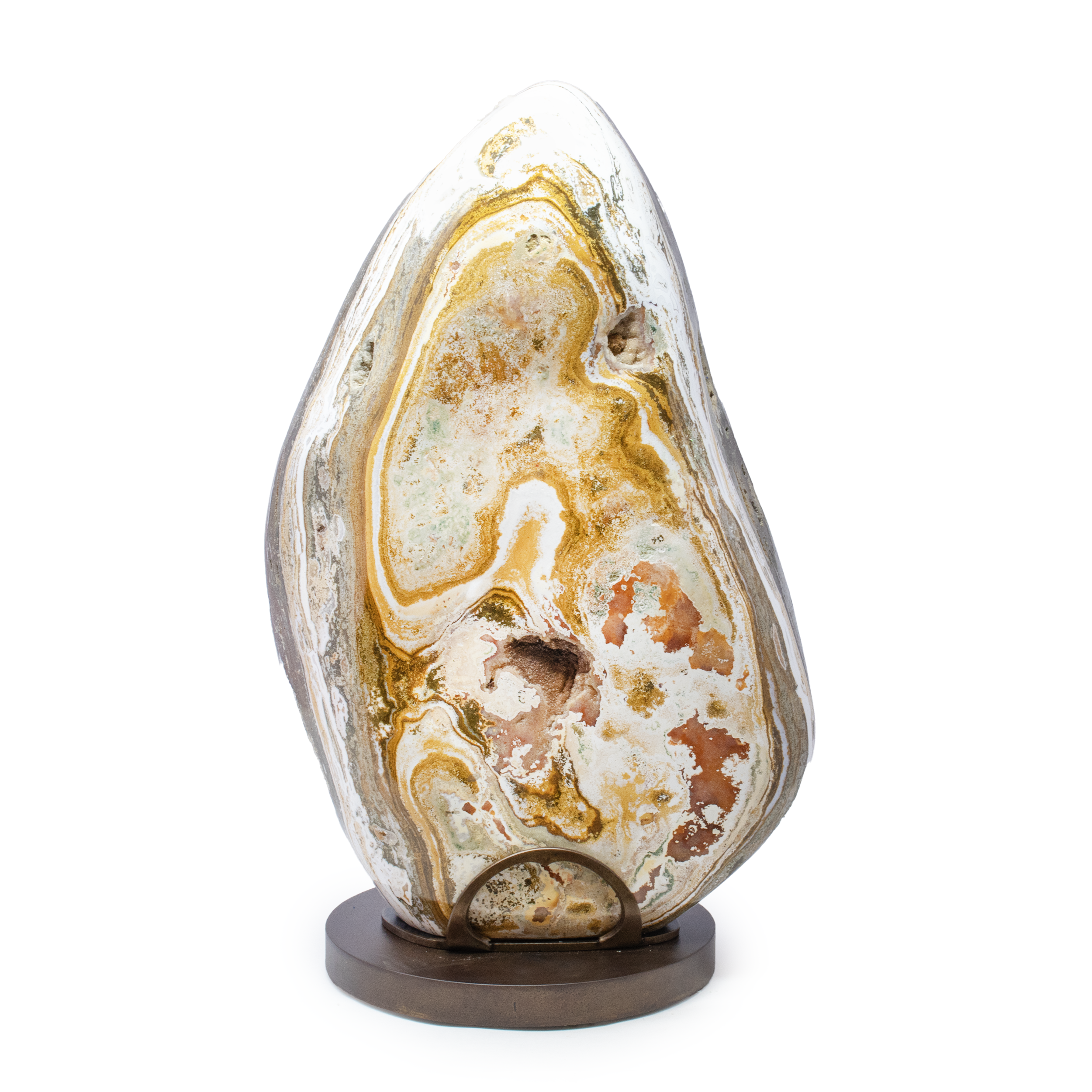 Introducing the Ocean Jasper FreeForm Set on Custom Rotating Stand with Patina Finish – an exquisite addition to your collection of statement minerals. Each piece in this meticulously curated set boasts the unique, captivating patterns and vibrant hues characteristic of Ocean Jasper, making it a true masterpiece of nature.The set is elegantly displayed on a custom rotating stand, crafted to showcase the stunning mosaics of this rare mineral from every angle. The stand features a patina finish, adding an artisanal touch that complements the natural beauty of the minerals. Its sleek design ensures that it remains a statement piece in any setting, while the gentle rotation allows you to appreciate the intricate details and vivid colors of the Ocean Jasper over time.Perfect for collectors and enthusiasts alike, this Ocean Jasper FreeForm Set is not only a celebration of geological wonders but also an embodiment of elegance and style. Whether displayed in your living space, office, or gallery, these statement pieces promise to captivate and inspire all who behold them. Ocean Jasper FreeForm Set on Custom Rotating Stand Patina Finish
