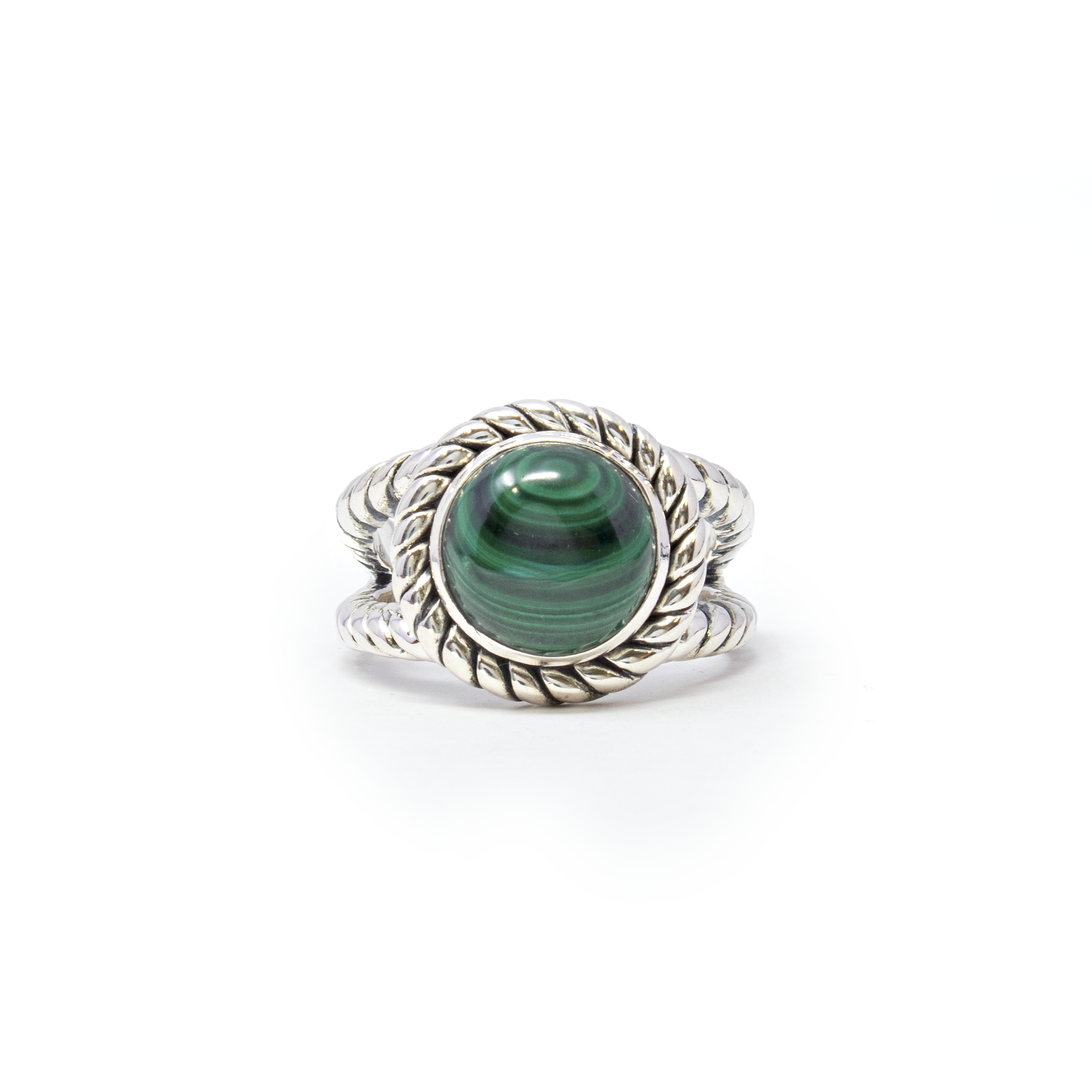 Indulge in the captivating allure of our Malachite Ring, a perfect fusion of classic design and natural beauty. This exquisite piece features a mesmerizing round malachite cabochon, known for its rich green hues and distinctive banding patterns, making each ring uniquely enchanting.Set in a finely crafted 925 sterling silver bezel, the malachite stone takes center stage, framed by an elegant rope edge that adds texture and sophistication. The double band design not only enhances the ring's durability but also provides a comfortable fit, ensuring elegance and ease in every wear. Malachite Ring - Round Cabochon Set on 925 Sterling Silver Bezel with Rope Edge & Double Band sz10