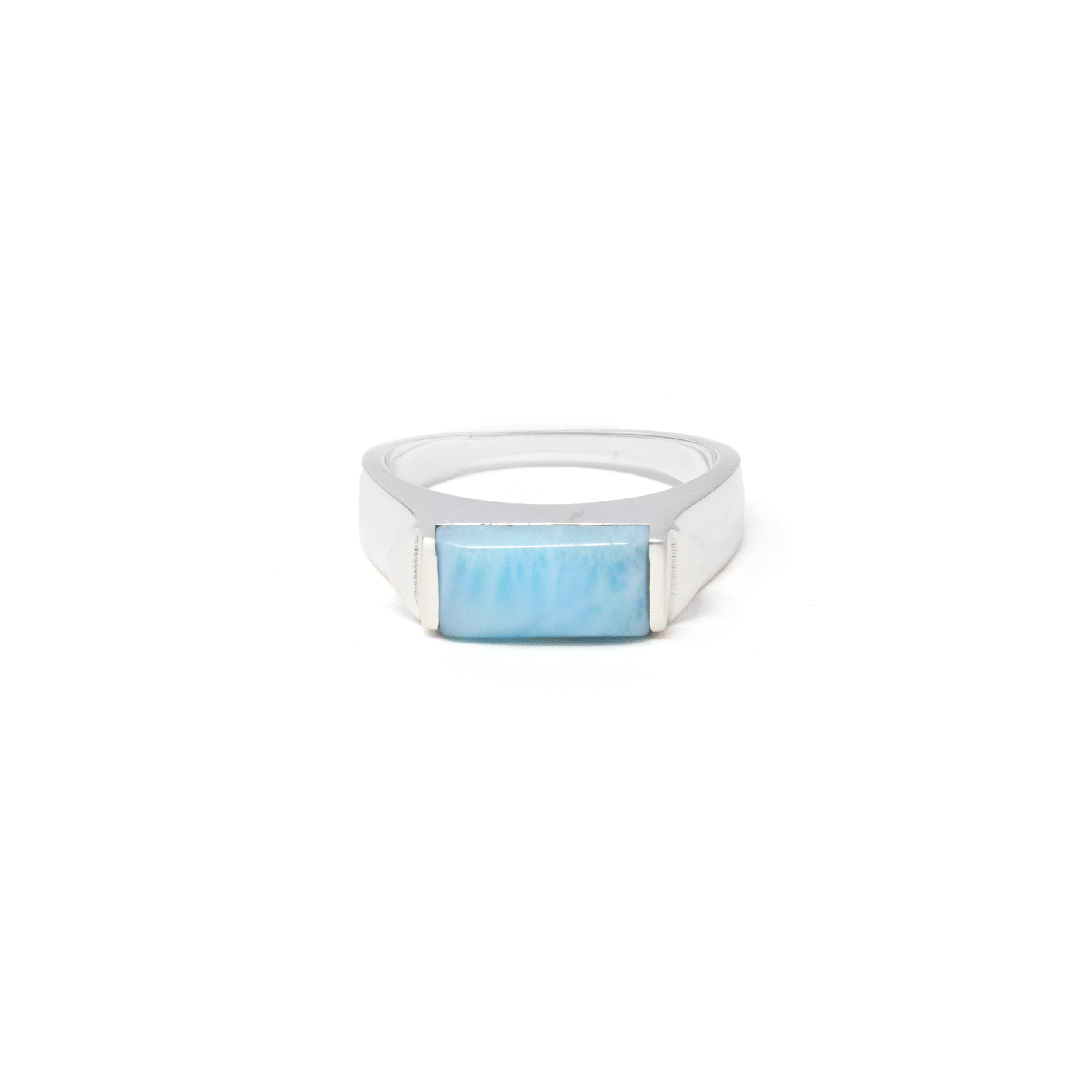 Elevate your jewelry collection with the exquisite Larimar Ring, a stunning piece that exudes elegance and timeless beauty. This eye-catching ring features a striking rectangle cabochon of Larimar, a rare Caribbean gemstone renowned for its captivating sea-blue hues and unique patterns reminiscent of ocean waves. Carefully set in a 925 sterling silver signet band, the ring boasts a sophisticated and durable finish that enhances the gemstone's natural allure. Larimar Ring - Rectangle Cabochon Set in 925 Sterling Silver Signet Band with Triangle Accent sz13