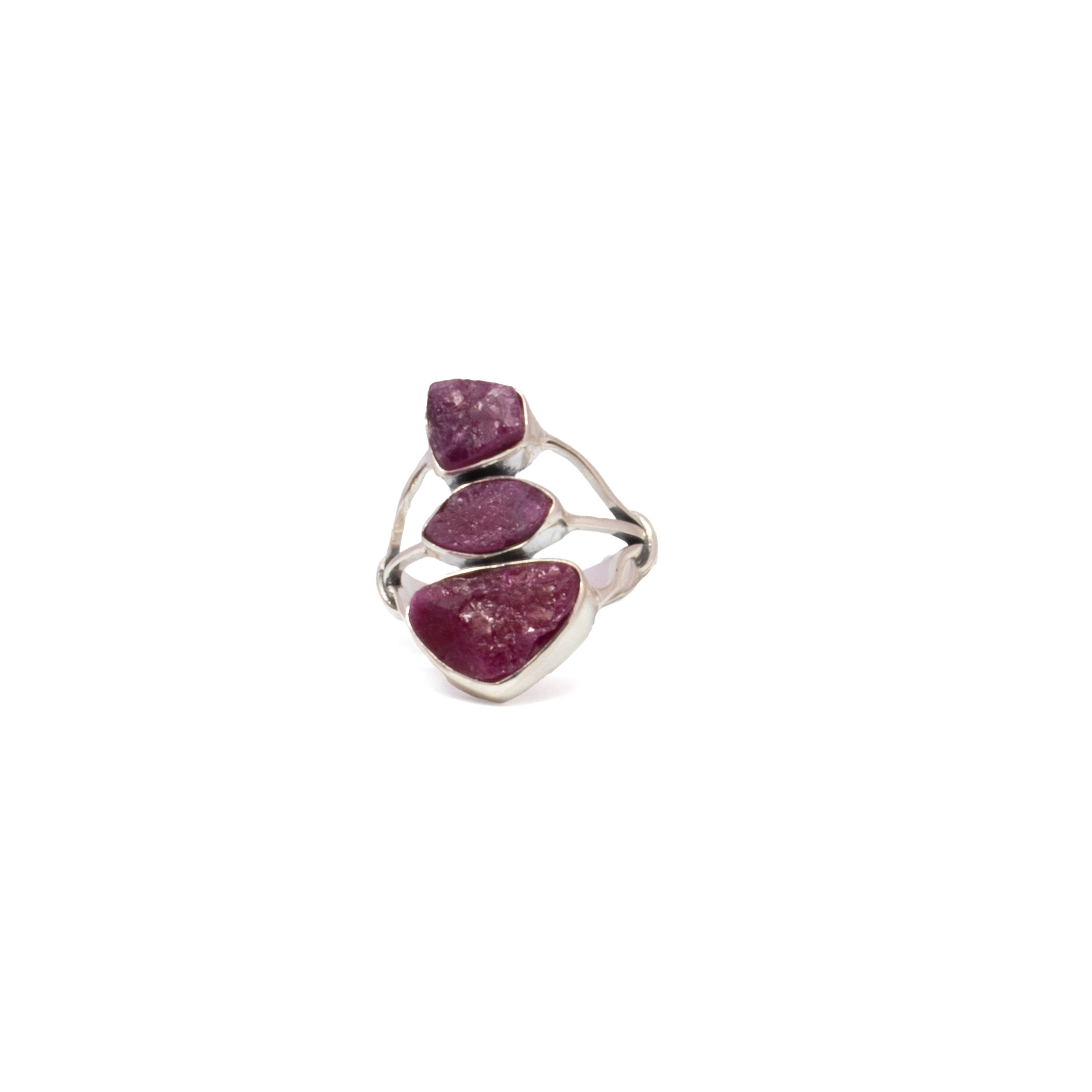 Three raw ruby crystals sit boldly atop this modern open tri-top band, each one bezel set in minimalist 925 sterling silver. The unpolished stones offer rich red tones and organic texture, while the geometric layout creates clean, contemporary lines. Sized at 9, this handcrafted ring fuses natural elegance with sculptural design—ideal for anyone drawn to the rare and the refined. Ruby Ring - Rough Geometric Trio with 925 Sterling Silver Bezels Set on Open Tri-Top Band sz9