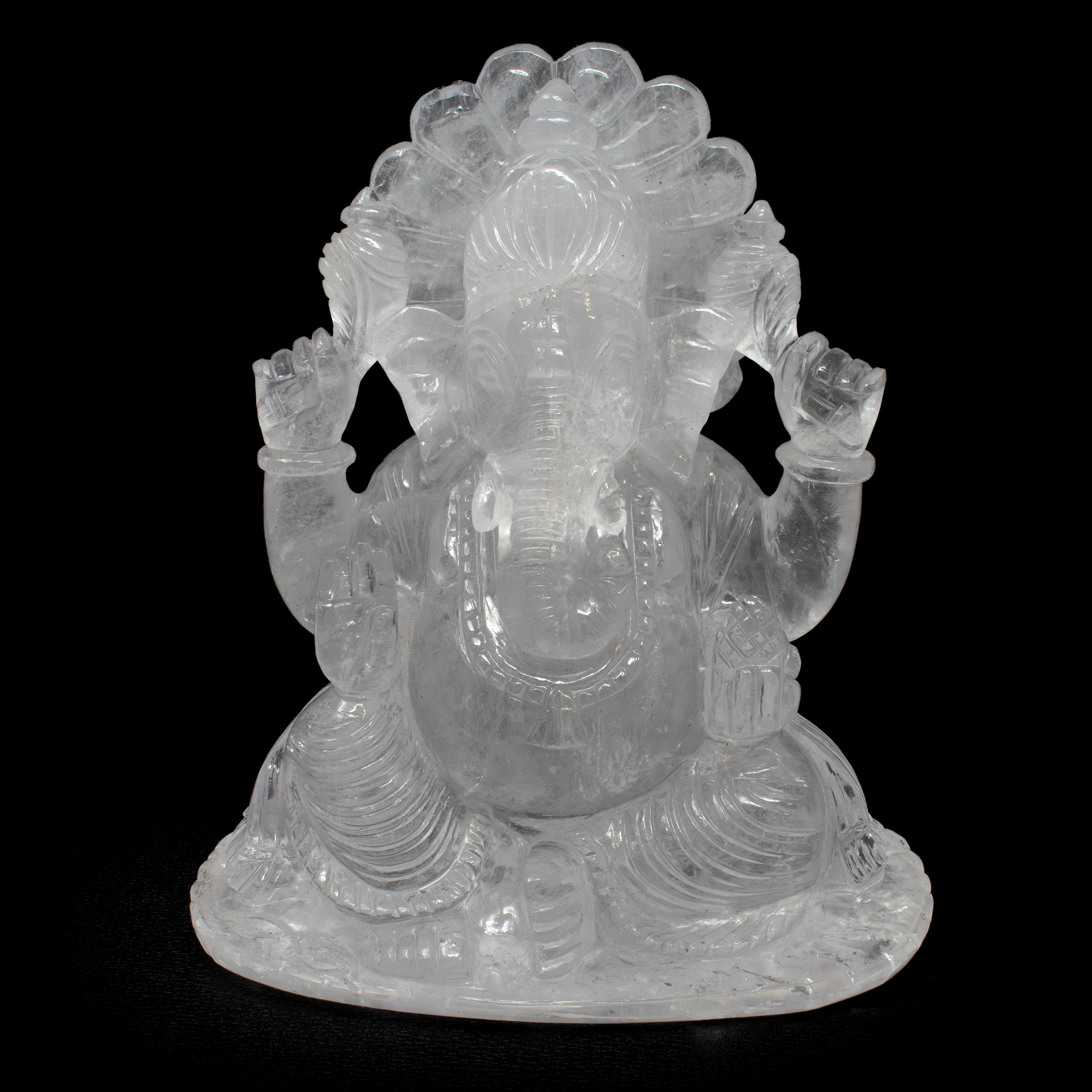 Elevate your home decor with our exquisite 7.5 inch tall Quartz Ganesh Carving, a harmonious blend of artistry and spirituality. Meticulously handcrafted by skilled artisans, this captivating sculpture embodies the divine essence of Lord Ganesh, the remover of obstacles and the symbol of wisdom and prosperity.Crafted from high-quality, genuine quartz, known for its clarity, durability, and metaphysical properties. Quartz is revered for its ability to amplify positive energy and promote a balanced, harmonious atmosphere. Quartz Ganesh Carving