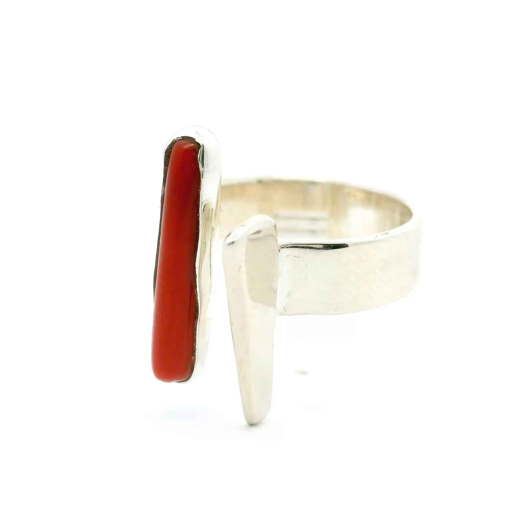 Add a splash of vibrant elegance with our Mediterranean Coral Ring. Featuring a genuine coral tube cabochon bezel-set in 925 sterling silver, this ring blends classic beauty with a modern silver triangle accent. Designed in size 7 with open adjustability, it offers a perfect, comfortable fit. A striking piece for everyday wear or special occasions, this ring captures the timeless allure of the Mediterranean with contemporary sophistication. Mediterranean Coral Ring - Tube Cabochon Bezel Set with Silver Triangle with Open Adjustability in 925 Sterling Silver sz7
