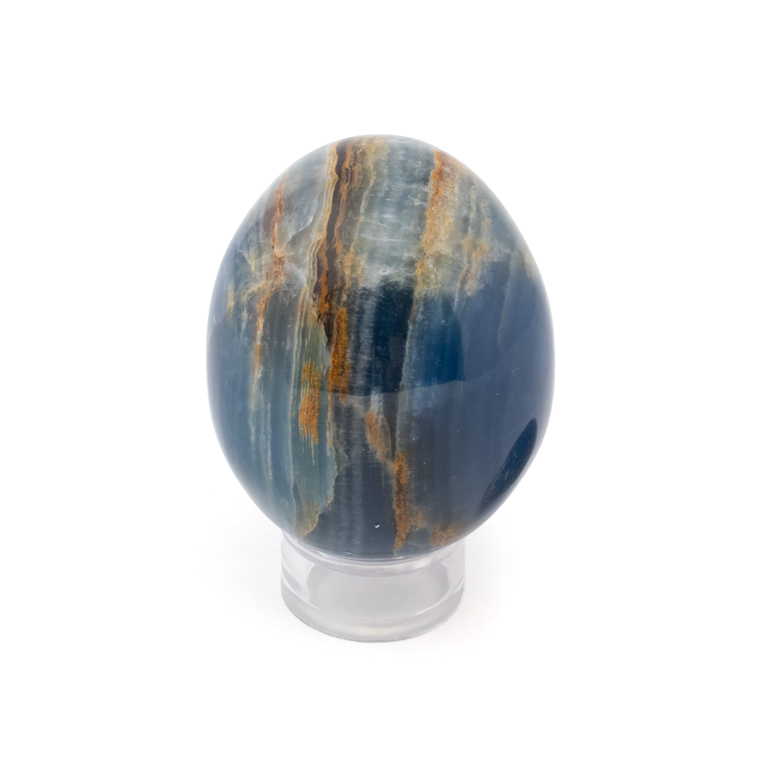 Introducing the A+ Argentinian Blue Calcite Egg with Lucite Ring Stand—a captivating addition to any crystal collection or home décor setting. This exquisite piece showcases the mesmerizing beauty of Argentinian Blue Calcite, renowned for its soothing hues and natural elegance.Adorn your space with the serene charm of this blue calcite egg. The gentle swirls of sky blues and subtle whites create a harmonious pattern reminiscent of serene ocean waves, drawing the eye and uplifting the spirit. Each egg is thoughtfully polished to highlight its unique, natural characteristics, ensuring that no two are exactly alike.The egg is complemented by a minimalist lucite ring stand, providing a modern and sophisticated display option. The transparent stand allows the calcite egg to take center stage, creating a floating effect that enhances its ethereal presence. Whether displayed on a shelf, desk, or as part of a crystal grid, this piece adds a touch of tranquility and refinement. A+ Argentinian Blue Calcite Egg with Lucite Ring Stand