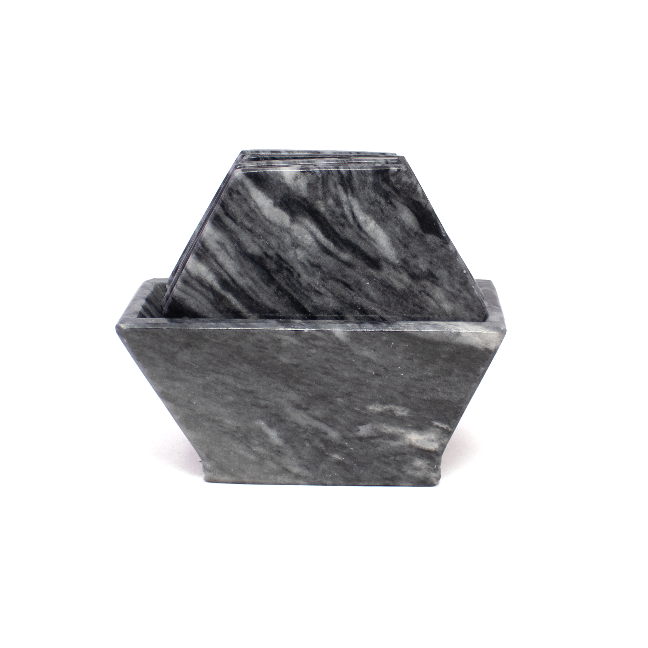 Refine your table setting with this elegant Set of 6 Gray Marble Coasters, each crafted from natural onyx with soft gray marbling and a modern hexagonal silhouette. Designed to elevate both form and function, these coasters offer a sleek surface for protecting your tabletops from moisture, heat, and spills.The set includes a matching stone holder that keeps the coasters neatly stacked and easily accessible, making it as practical as it is visually refined. Whether used during gatherings or enjoyed daily, these coasters bring understated luxury to your coffee table, dining area, or office. Gray Marble Coasters - Set of 6 with Holder - Hexagons