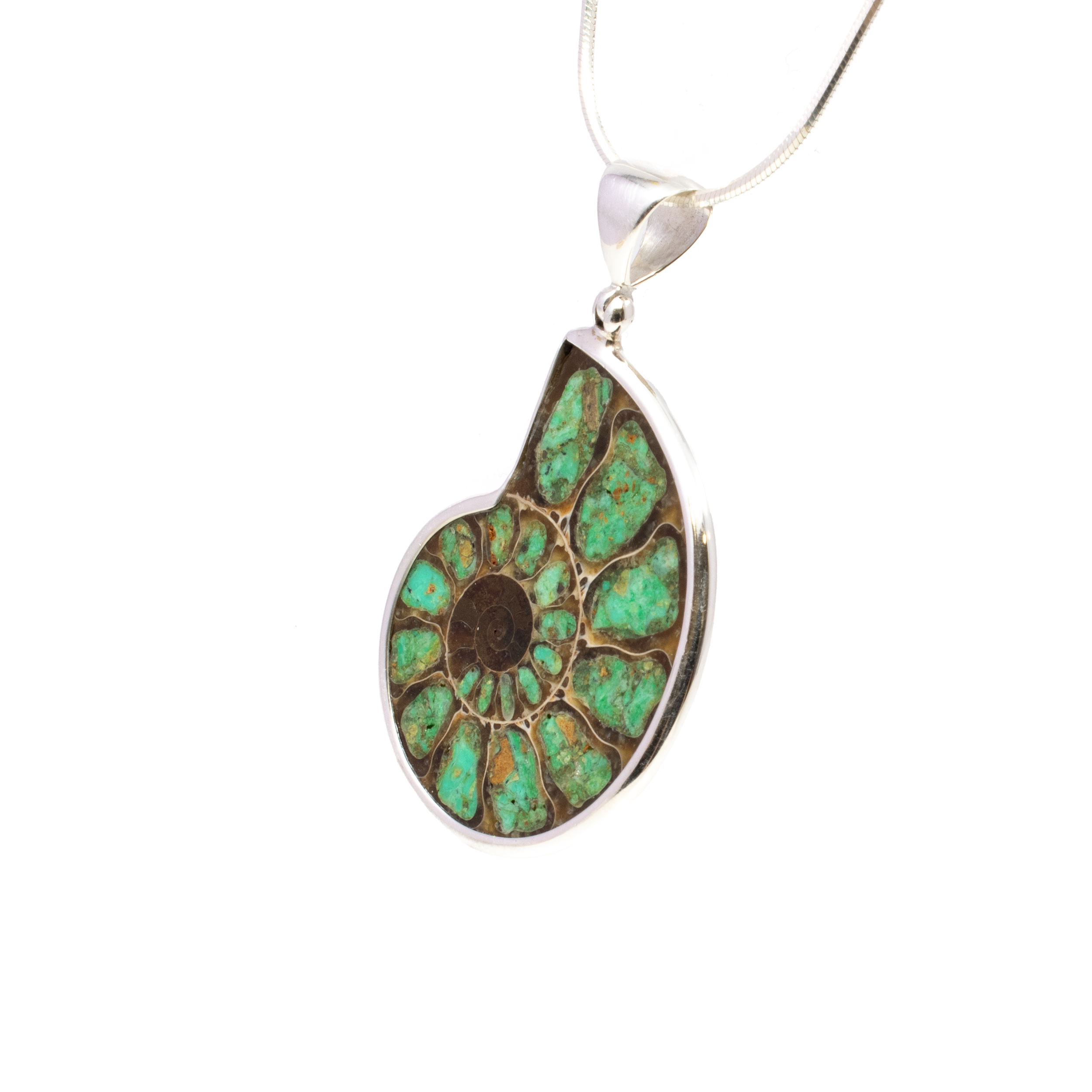 Discover a piece of history elegantly captured in the Ammonite Fossil Pendant, a jewelry piece that seamlessly blends natural beauty with timeless sophistication. This exquisite pendant features an open ammonite cross-section, showcasing the intricate spiral patterns and rich textures that tell a story millions of years in the making.Each ammonite fossil is inlaid with stunning smithsonite, a mineral known for its serene and captivating hues. The combination of the ancient ammonite and the vibrant smithsonite creates a striking contrast that is sure to catch the eye and spark conversation.The fossil and stone are securely held in a classic bezel setting, crafted from high-quality 925 sterling silver. The simple yet elegant setting allows the unique beauty of the ammonite and smithsonite to take center stage, making it a perfect accessory for both everyday wear and special occasions. Ammonite Fossil Pendant - Open Ammonite Cross-section Inlaid with Smithsonite Bezel Set in Simple 925 Sterling Silver