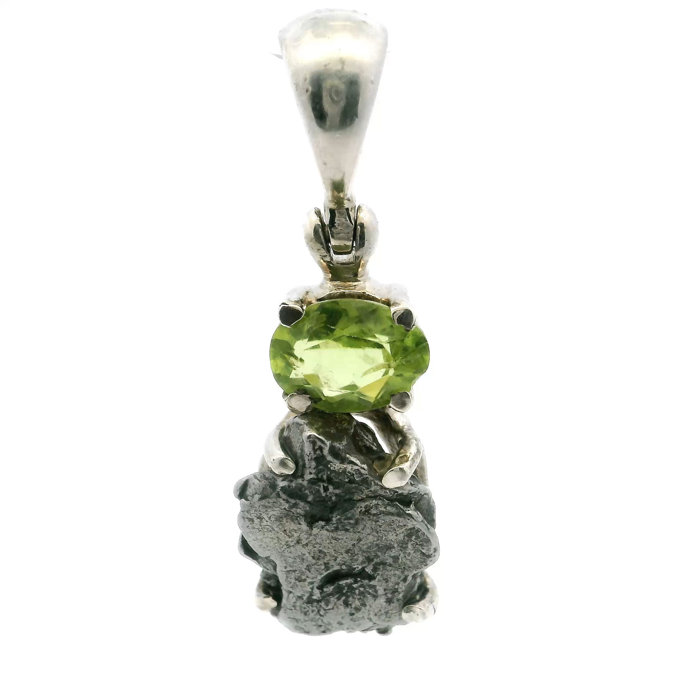 Experience a stunning blend of cosmic wonder and earthly charm with our exclusive Women's Meteorite and Peridot Pendant. At its center is a genuine meteorite fragment—each one a rare piece of the universe, etched with natural patterns that tell a story millions of years in the making.Paired with a vivid green peridot, known as the gem of the sun, this pendant radiates freshness and energy. The contrast between the meteorite’s dark shimmer and the peridot’s vibrant glow creates a striking, balanced design full of meaning and beauty.Set in your choice of sterling silver or gold, the pendant is crafted with care to ensure both elegance and durability. It hangs from a graceful chain, perfect for everyday wear or adding a touch of wonder to special occasions.This pendant is more than jewelry—it’s a unique keepsake that celebrates individuality, growth, and the awe of the cosmos. A perfect gift or a meaningful addition to your own collection. Campo De Cielo Meteorite Pendant - Meteorite Rough Prong Set Below Faceted Peridot Oval Prong Set in 925 Sterling Silver