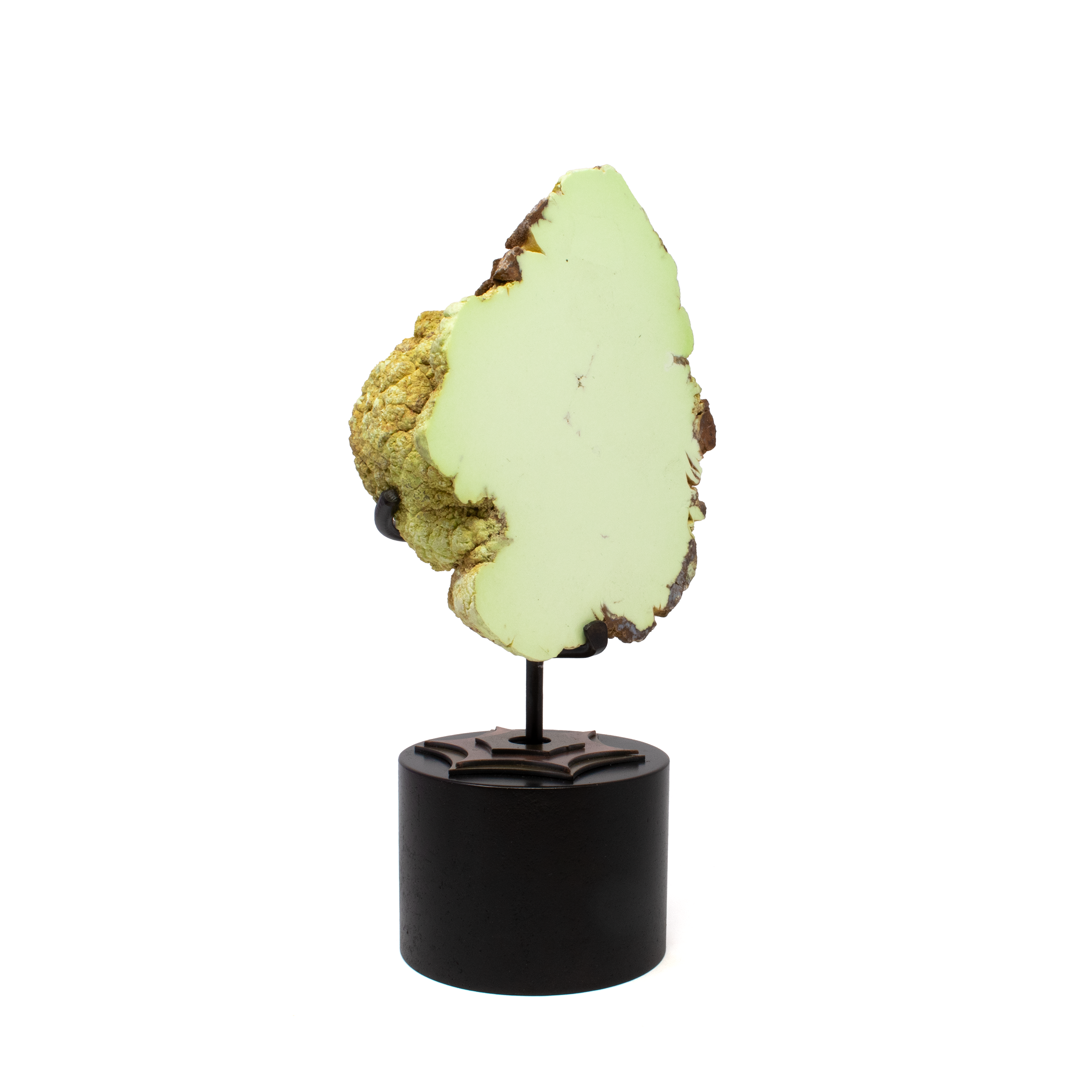 Introduce a touch of natural elegance to your space with our stunning Pastel Green Chrysoprase End Cut, sourced exclusively from the rich landscapes of Australia. This exquisite piece is perfect for those who appreciate unique, high-quality tabletop accessories that transcend typical home decor.The soft, soothing green tones of this chrysoprase create a harmonious and serene atmosphere in any room. Its pastel shades add an element of calm and sophistication to your home decor.Each chrysoprase end cut is selected for its unique and clean pattern, making every piece one-of-a-kind. The natural variations and vibrant mineral inclusions create an intriguing visual appeal that draws the eye. Pastel Green Chrysoprase End Cut on Rotation Custom Stand from Australia - Clean Pattern aka Citron Magnesite