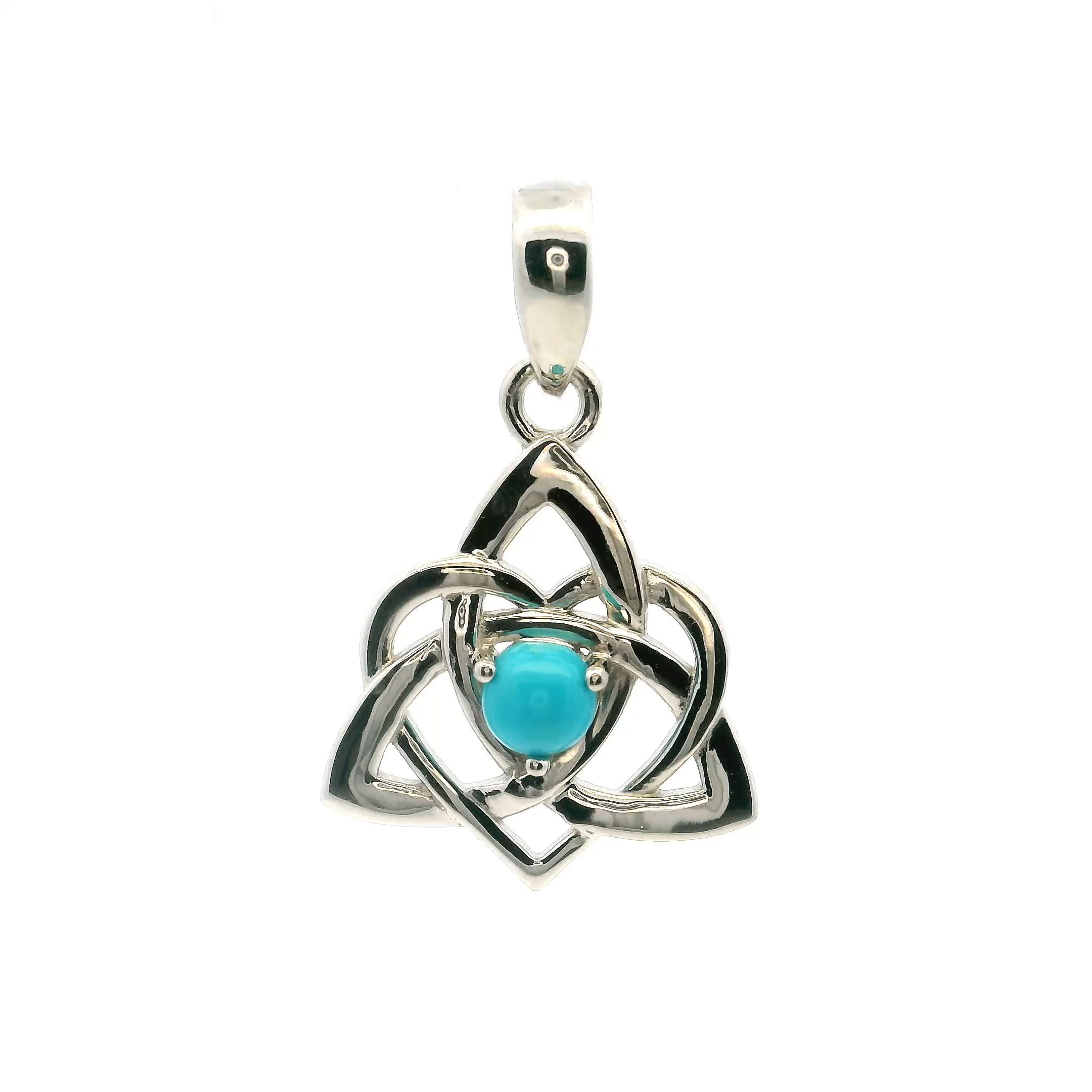 This New Mexican Turquoise Pendant features a round cabochon of vivid blue-green turquoise, its natural veining offering an organic texture that makes each piece one of a kind. Prong-set in 925 sterling silver, the stone rests within a graceful heart and Celtic knot frame—symbols of eternal love and interconnectedness woven into a design that honors both sentiment and heritage.The union of turquoise and silver creates a striking contrast, blending Southwestern charm with Celtic elegance in a pendant that feels both rooted and refined. Ideal for those drawn to meaningful motifs and natural gemstones, this piece brings warmth, depth, and intention to everyday adornment. New Mexican Turquoise Pendant - Round Cabochon in Heart & Celtic Knot Prong Set in 925 Sterling Silver