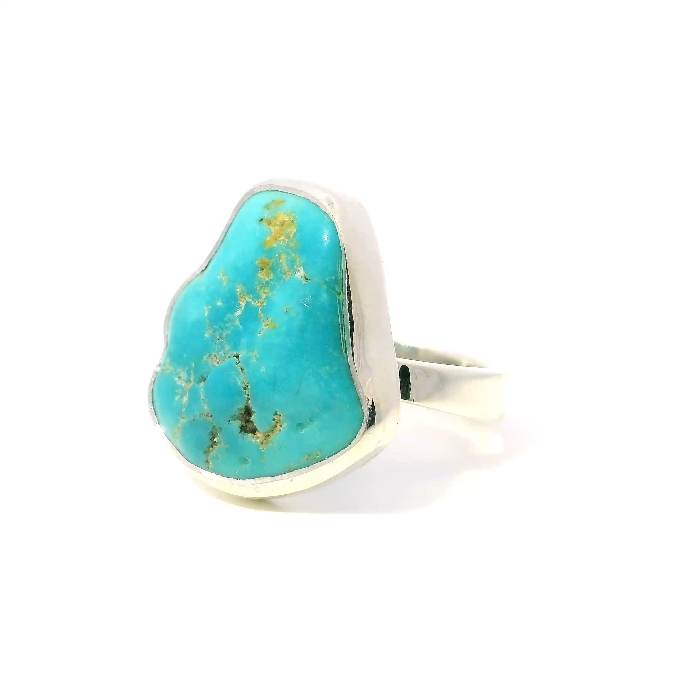 Introduce a touch of Southwestern elegance with the New Mexican Turquoise Ring, featuring a polished freeform turquoise stone celebrated for its vibrant hues and distinctive tan inclusions that add natural character and uniqueness. Set in a sleek, minimalist 925 sterling silver bezel, the design highlights the stone’s striking colors while maintaining a timeless and refined look.Crafted in size 8 for comfortable wear, this ring blends classic craftsmanship with contemporary style, making it a versatile statement piece that complements any outfit. Whether gifted or kept as a personal treasure, it embodies the beauty of nature and artisanal skill, perfect for those who cherish the authentic allure of turquoise jewelry. New Mexican Turquoise Ring - Polished Freeform with Tan Inclusions Bezel Set in 925 Simple Sterling Silver sz8