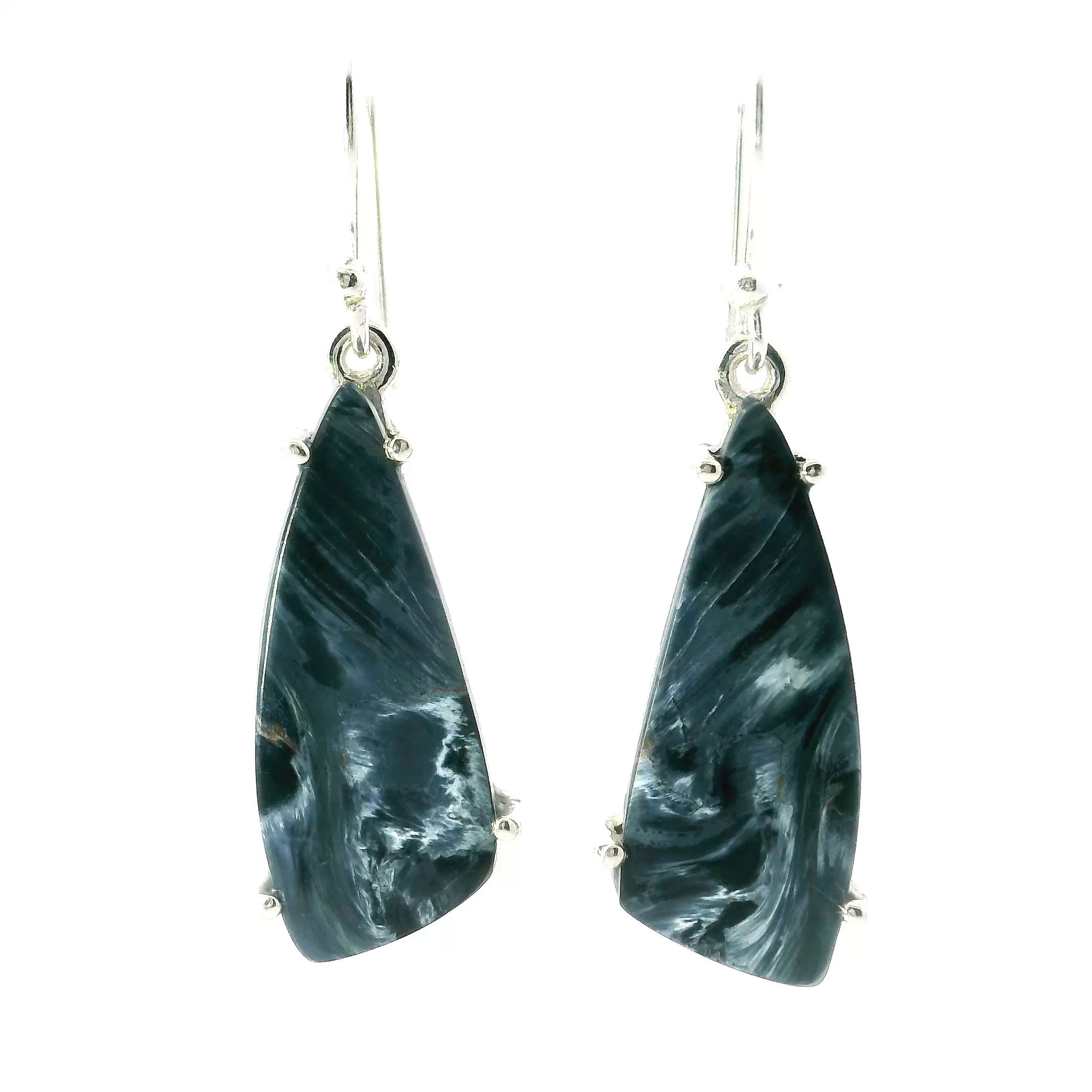 These captivating dangle earrings feature uniquely shaped Pietersite cabochons, prong set in polished 925 sterling silver. Swirling with deep blues, golds, and earthy browns, the stones—known as the “Tempest Stone”—evoke a sense of motion and mystery.With graceful movement and natural artistry, these earrings are perfect for elevating both everyday outfits and special occasions—a bold, elegant gift for lovers of unique gemstones and timeless design. Pietersite Dangle Earrings - Lung-Shaped Cabochon Prong Set in 925 Sterling Silver
