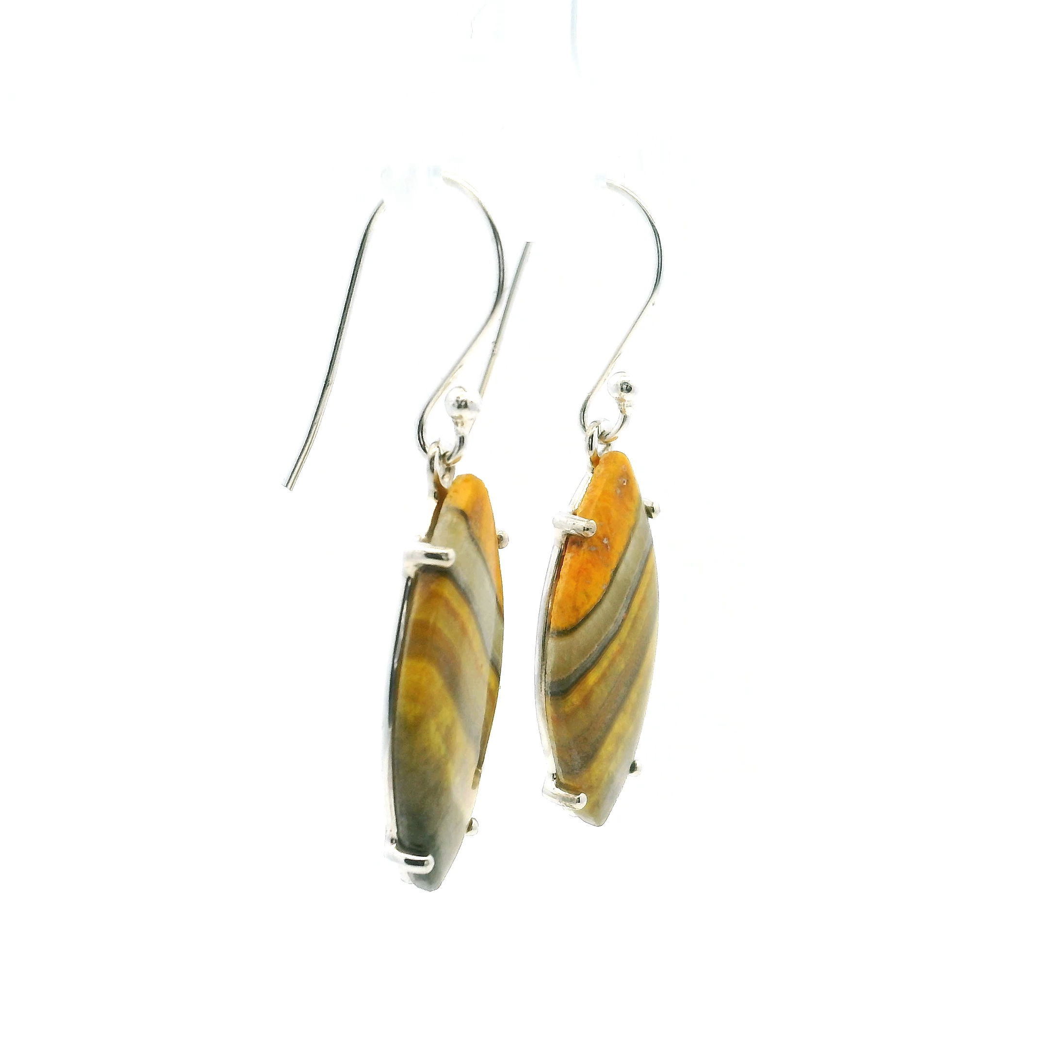 Our exquisite Bumblebee Jasper Dangle Earrings are a captivating fusion of natural artistry and refined design. Each earring features a sharp oval cabochon of bumblebee jasper, known for its striking yellow, gray, and cream banding that evokes the energy of volcanic earth. No two stones are alike, ensuring every pair is a one-of-a-kind expression of nature’s bold palette.Expertly set in 925 sterling silver, the prong settings not only secure the cabochons but allow light to pass through, enhancing the intricate color layers within the stone. These dangle earrings are both elegant and versatile—lightweight enough for daily wear yet striking enough to elevate any evening ensemble. A statement of style and a celebration of the earth’s vivid beauty, these earrings offer timeless charm with an unmistakable edge. Bumblebee Jasper Dangle Earrings - Sharp Oval Cabochon with Angled Yellow & Gray Banding Prong Set in 925 Sterling Silver