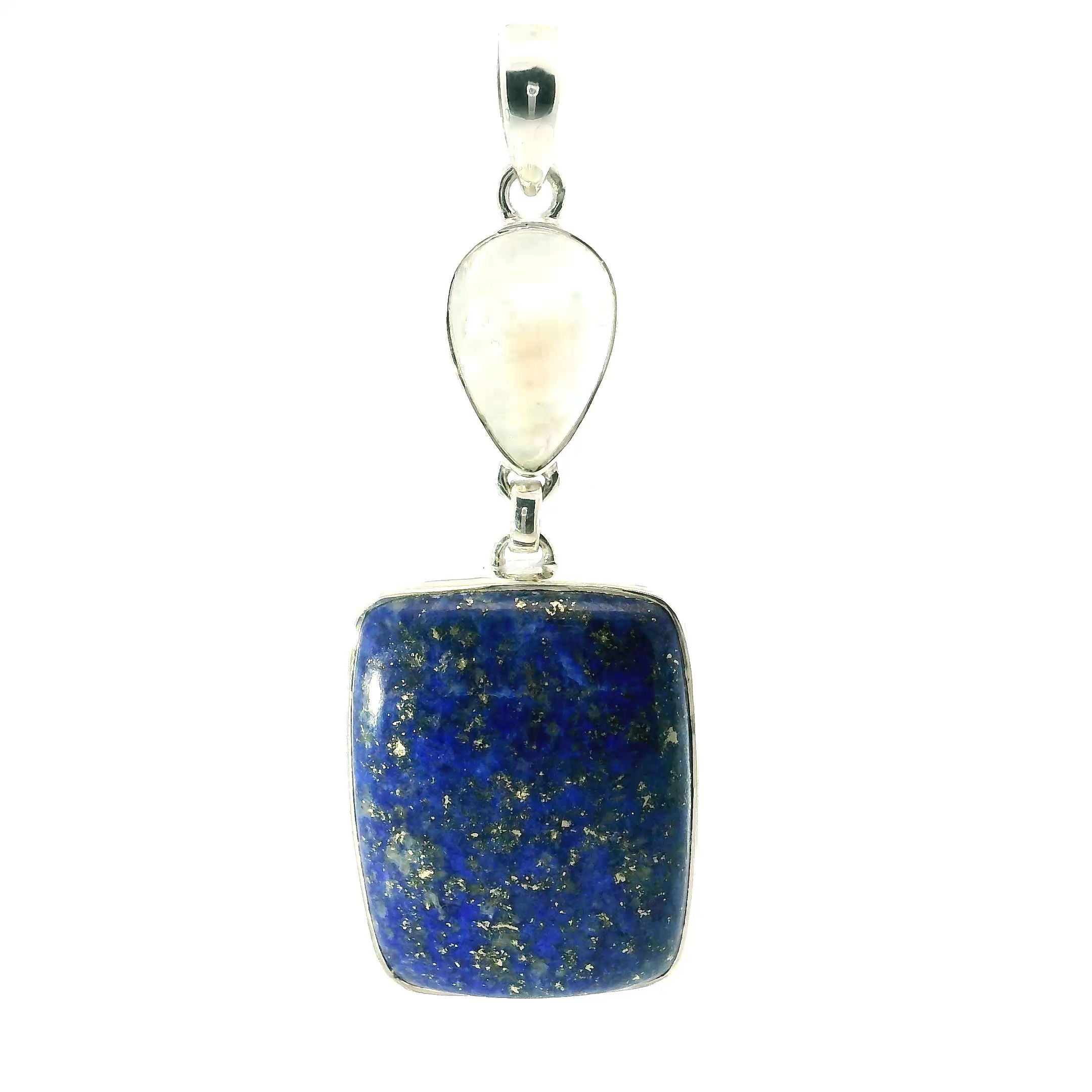 A luminous union of celestial stones, this Lapis Lazuli and Rainbow Moonstone Pendant in 925 sterling silver evokes timeless elegance and spiritual grace. A deep blue lapis lazuli cabochon anchors the piece with its signature golden pyrite flecks, while above, a delicately inverted teardrop of rainbow moonstone flickers with soft, iridescent light. Each gemstone is bezel set by hand, creating a refined, balanced silhouette.Offered without a chain, this pendant invites personalization and pairs beautifully with silver or leather. Wear it as a daily talisman of wisdom and intuition, or gift it to someone drawn to the mystic harmony of earth and sky. Lapis Lazuli Pendant - Rounded Rectangular Cabochon Below Inverted Rainbow Moonstone Teardrop Cabochon Bezel Set in 925 Sterling Silver