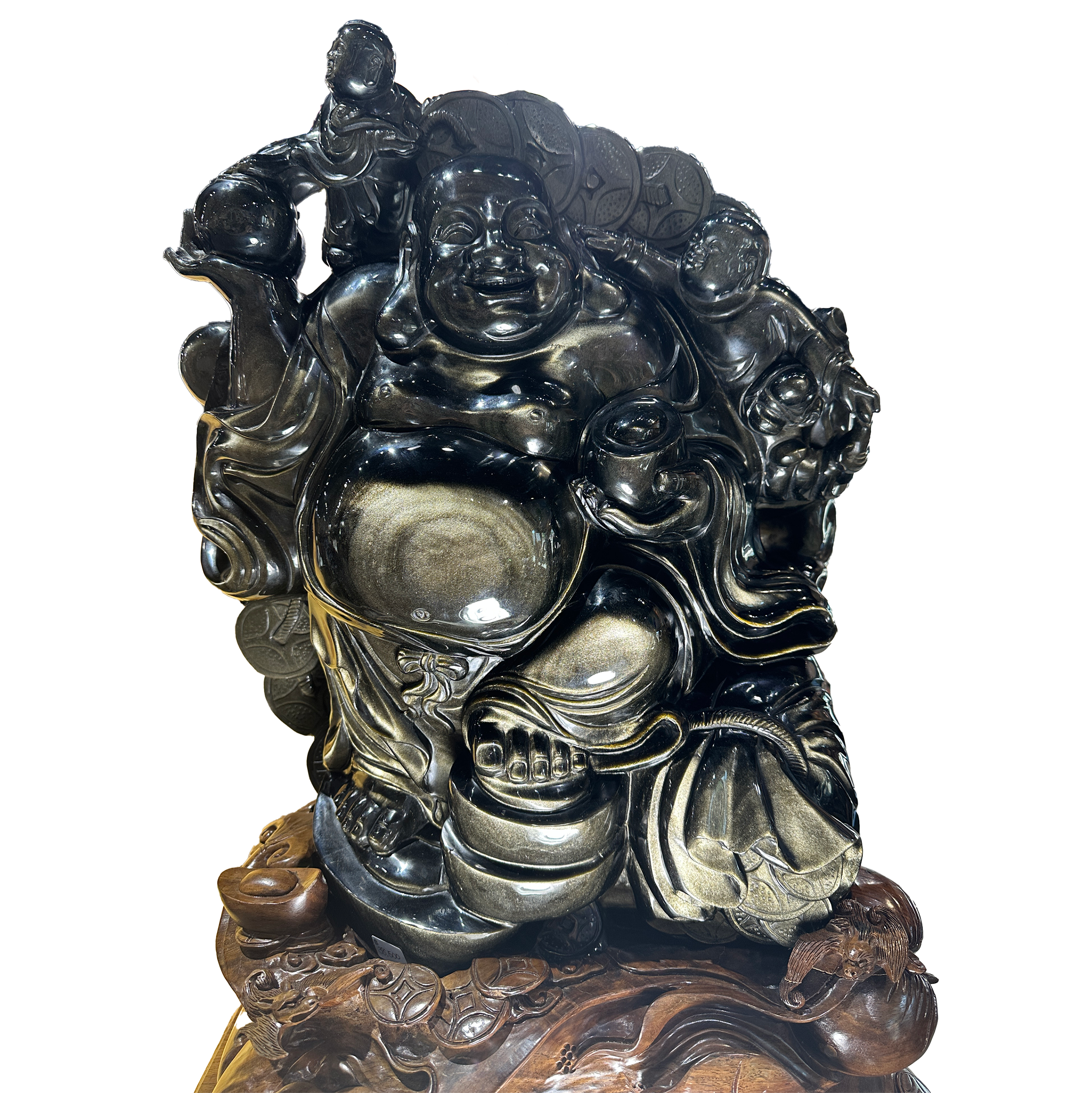 The A++ Gold Sheen Obsidian Happy Buddha Sculpture is a radiant expression of joy and abundance, hand-carved from premium gold sheen obsidian with mesmerizing iridescent waves that shimmer across its polished surface. This luminous gemstone—known for deflecting negativity and inviting clarity—finds its perfect form in the iconic image of the Happy Buddha, whose open smile and rounded posture symbolize good fortune, contentment, and spiritual well-being.Seated on a hand-carved wooden base that adds warmth and grounding to the composition, the sculpture balances refined craftsmanship with organic elegance. Ideal for display in a meditation space, living room, or office, it radiates a calming, uplifting energy while serving as a powerful focal point. A statement of both luxury and spiritual resonance, this Buddha brings harmony, light, and a touch of sacred beauty to any interior. A++ Gold Sheen Obsidian Happy Buddha Sculpture with Carved Wooden Base
