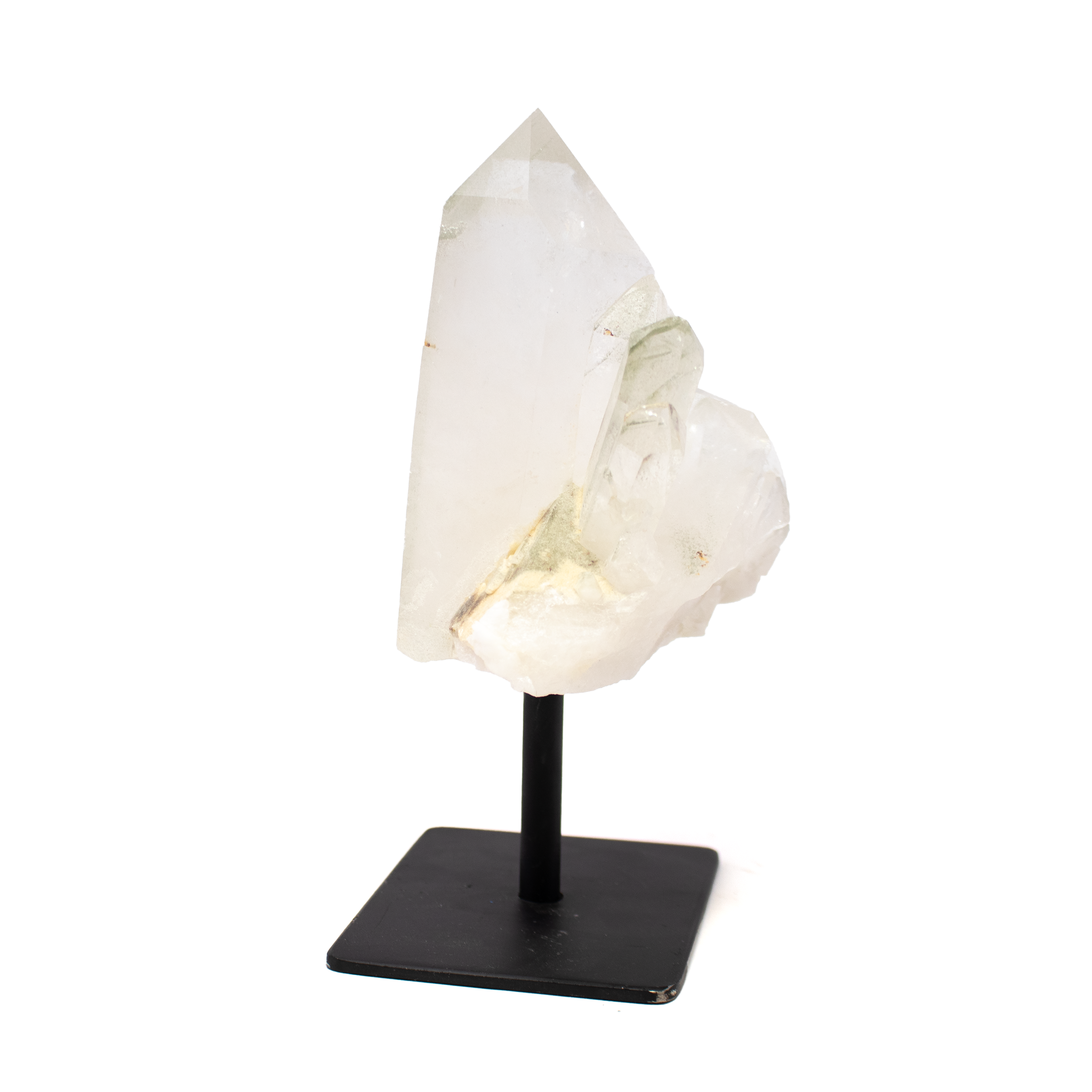 The Quartz Crystal Cluster on Metal Post Stand from Brazil radiates luminous clarity and natural elegance, showcasing a stunning array of crystalline points that shimmer with every angle. Sourced from Brazil’s mineral-rich terrain, each cluster is a one-of-a-kind formation—an organic sculpture that captures light and energy in its purest form.Mounted on a sleek metal post stand, the crystal floats with quiet sophistication, offering a striking visual contrast between the raw quartz and refined display. Known for its amplifying and cleansing properties, quartz brings an added layer of harmony and focus to your space, making it an ideal centerpiece for interiors that seek balance, inspiration, and timeless beauty. Quartz Crystal Cluster on Metal Post Stand from Brazil
