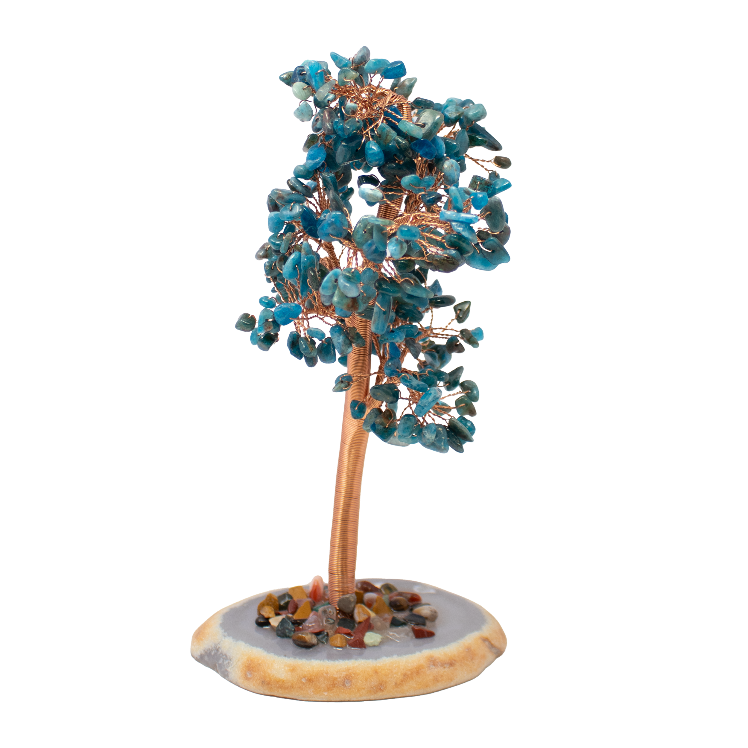 Bring a serene energy to your space with this handcrafted 8" Blue Apatite Copper Wire Tree, gracefully set on a polished agate slice base. Vivid blue apatite beads shimmer across adjustable copper branches, evoking movement, clarity, and expression. The tree rises from a natural agate foundation, its soft banding and grounding energy balancing the luminous quality of the crystals above.A statement piece for desks, meditation spaces, or display shelves, this sculpture blends artisan detail with metaphysical depth—blue apatite is known to stimulate insight, communication, and personal growth. Whether gifted or self-selected, this gemstone tree is both a striking decorative accent and a quiet reminder of inner wisdom and beauty. 8" Blue Apatite Copper Wire Beaded Tree on Agate Slice Base - Large
