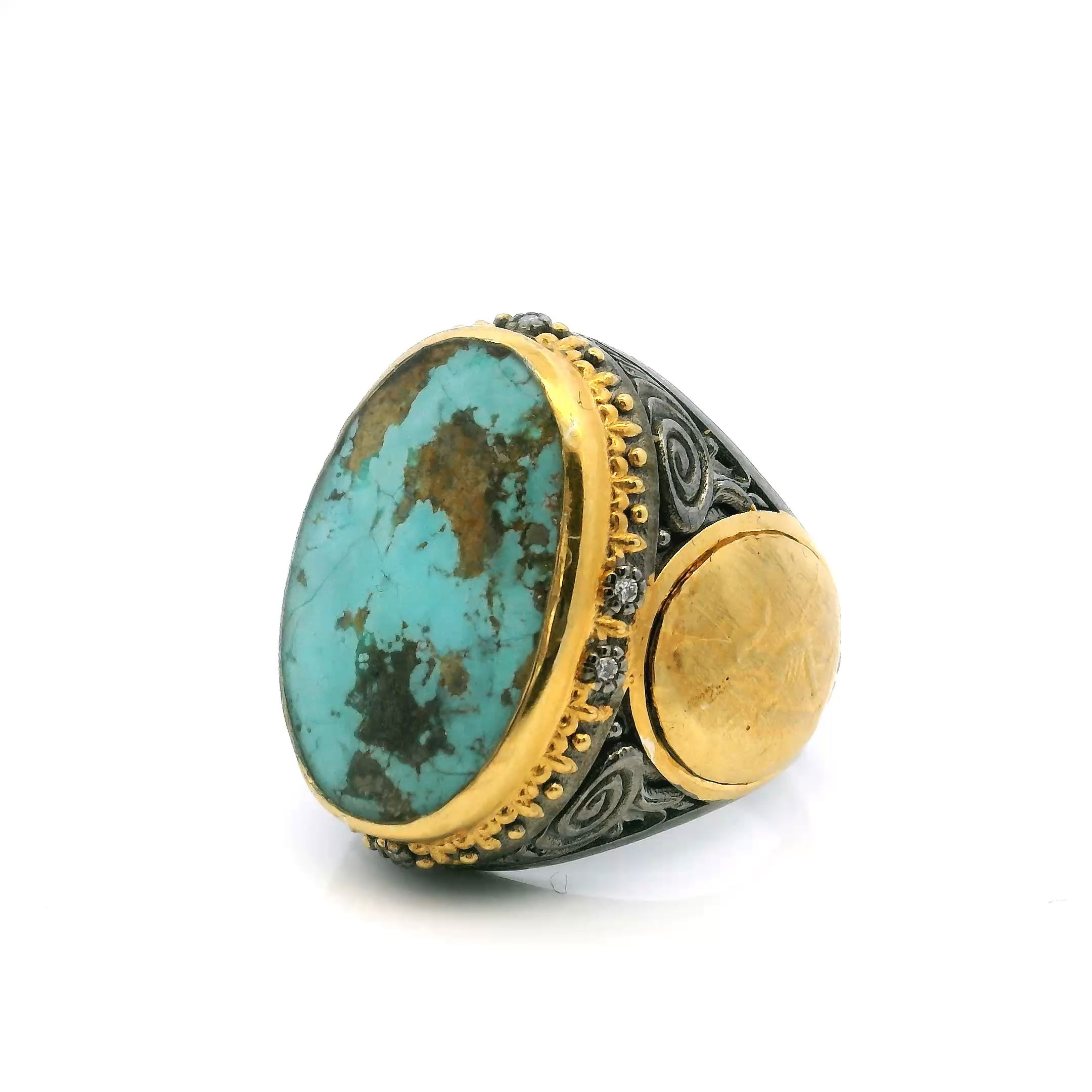 Elevate your collection with this exquisite Persian Turquoise Ring, crafted in size 9 for an impeccable fit. The centerpiece features a vivid oval cabochon of genuine Persian turquoise, celebrated for its intense blue hues and natural matrix. Flanking the stone, detailed coin motifs lend antique elegance, while a halo of bezel-set diamonds surrounds the centerpiece, amplifying its luminous appeal.Sculpted from 925 sterling silver and accented with rich 24K gold vermeil, the ring balances timeless tradition with contemporary artistry. A statement piece designed to captivate, it makes a refined and heirloom-worthy addition to any jewelry collection. Persian Turquoise Ring - Oval Cabochon with Side Coin Details & Diamonds Bezel Set in 925 Sterling Silver with 24K Gold Vermeil Accents sz9