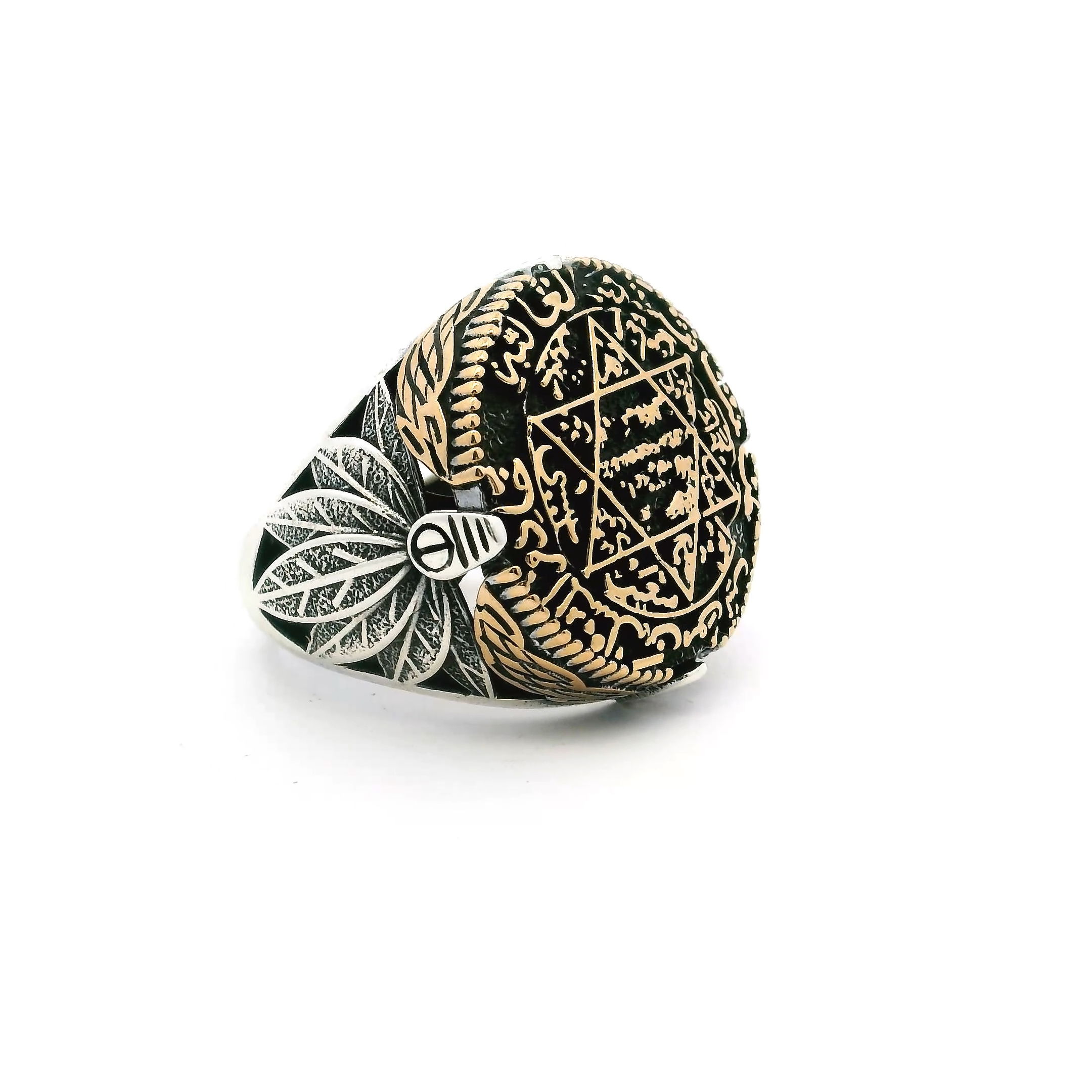 Elevate your style with this striking Sterling Silver Ring, expertly crafted in premium 925 sterling silver and finished with radiant gold vermeil accents. At its center, a substantial round top showcases a finely detailed Star of David, enhanced by intricate Hebrew script that lends rich spiritual depth and meaning.Bold leaf motifs cascade gracefully down the sides of the band, adding dimension, texture, and artisanal flair. Designed in size 11, this ring makes a powerful statement—ideal for everyday wear or special occasions, and a timeless addition to any jewelry collection that honors heritage, symbolism, and craftsmanship. Sterling Silver Ring - Large Round Top with Star of David & Hebrew Writing with Side Leaf Details in 925 Sterling Silver with Gold Vermeil Accents sz11