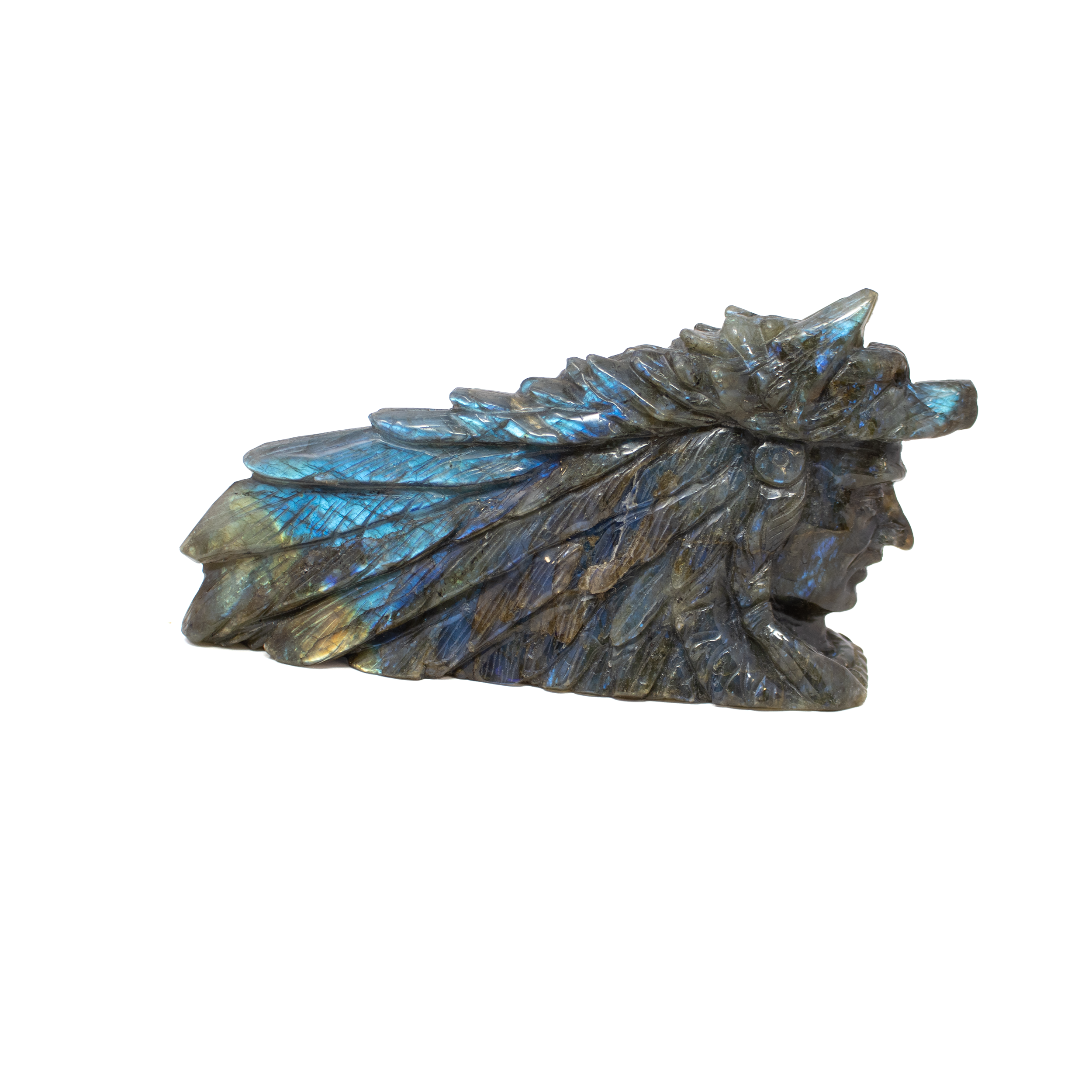 Unleash the mystique of nature with our A+ Labradorite Indian with Wolf Carving, a powerful tribute to ancestral wisdom and spiritual guardianship. Hand-carved from premium labradorite, this captivating sculpture radiates with natural iridescence—flashes of blue, green, and gold dance across its surface, breathing life into the detailed visage of a tribal elder and his loyal wolf companion. The headdress feathers, facial lines, and alert expression of the wolf are rendered with remarkable precision, evoking a deep sense of reverence and connection.Both a meaningful symbol and a stunning work of art, this piece is ideal for collectors, crystal lovers, and those drawn to Native-inspired motifs and the energy of transformation. Let it command attention on a shelf, altar, or desk—where its luminous beauty and storytelling presence inspire reflection, resilience, and intuitive strength. A+ Labradorite Indian with Wolf Carving