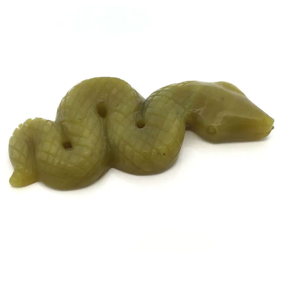 The Lemon Jade 4" Snake Ready-to-Strike Carving embodies poised energy and graceful transformation in pale yellow jade. Handcrafted with expert precision, this sculpture captures the tense alertness of a snake moments before it strikes, symbolizing wisdom, protection, and new beginnings. The smooth, luminous jade surface highlights delicate details of scales and curves, making each piece uniquely vibrant and elegant.Ideal as a striking accent for home or office décor, or as a meaningful gift, this carving brings serene vitality and symbolic depth to any collection. Measuring 4 inches long, it stands as a testament to masterful craftsmanship and timeless natural beauty. Lemon Jade 4" Snake Ready-to-Strike Carving