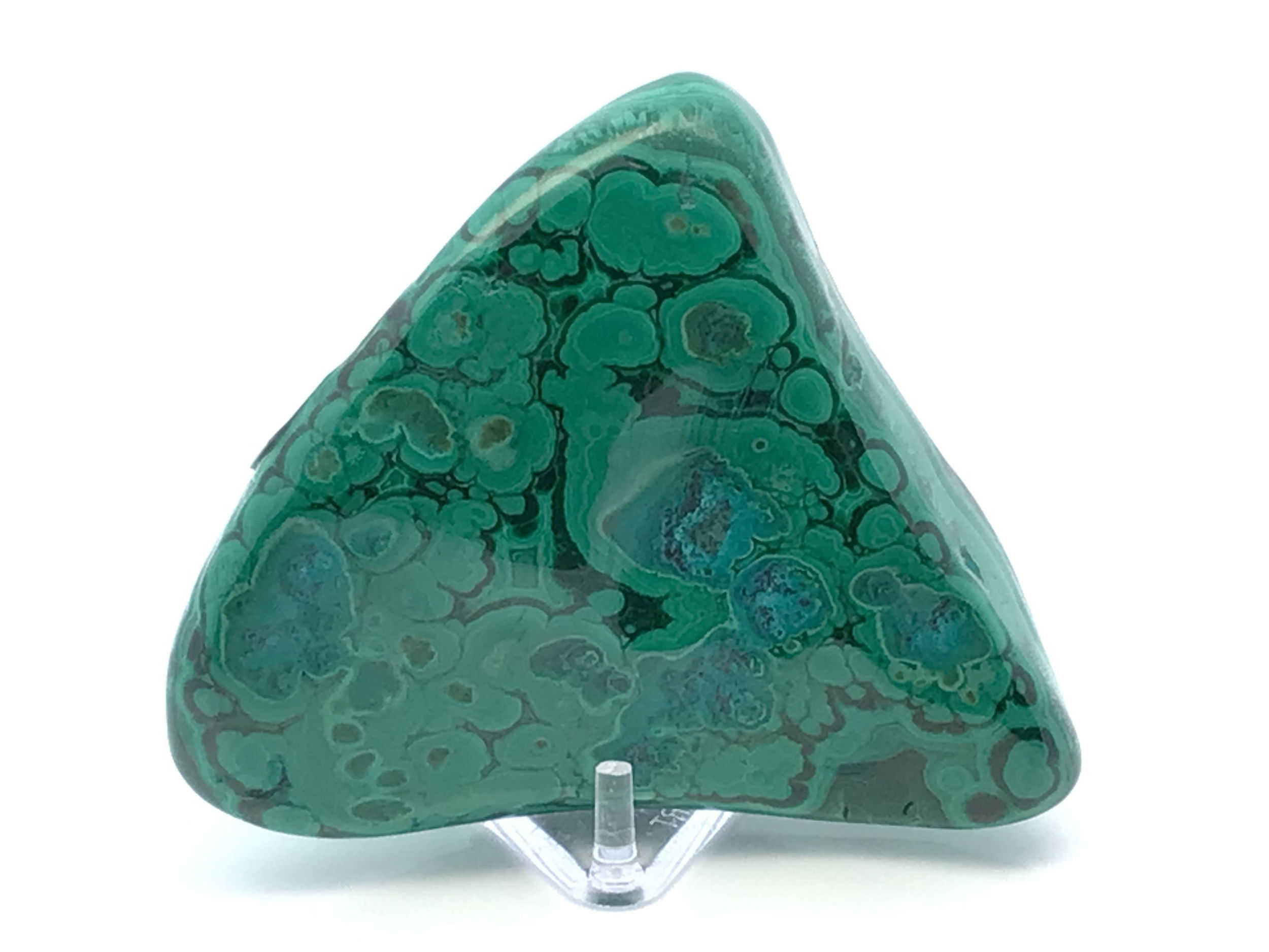 Discover the mesmerizing beauty of our Chrysocolla Malachite Polished Freeform from the Congo, a true masterpiece of nature. Expertly hand-polished to reveal stunning swirls of deep teal Chrysocolla and lush green Malachite, this striking triangular-shaped crystal radiates soothing energy and vibrant color. Each stone is unique, displaying intricate patterns and natural inclusions that make it one-of-a-kind.Presented on a sleek Lucite stand, this tumbled freeform is perfect for display in your home, office, or sacred space. Ideal for collectors, crystal enthusiasts, or anyone seeking inspiration and tranquility, this Chrysocolla Malachite freeform combines artistry and earth’s magic in a captivating piece. Chrysocolla Malachite Polished Freeform from Congo with Lucite Stand - Triangular Shape