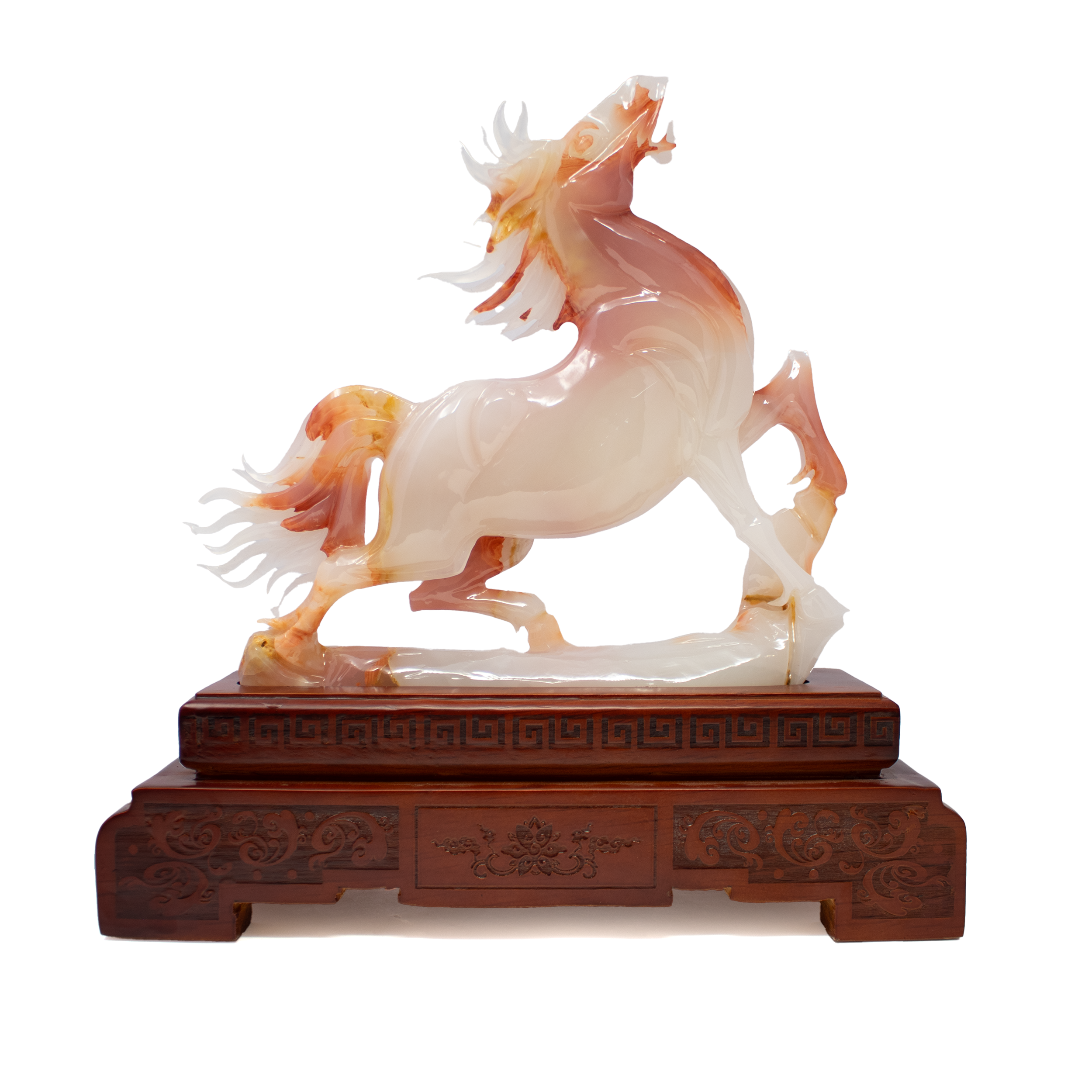 The A++ Red Onyx Horse Carving on Wooden Base captures the dynamic spirit of the horse in fiery natural stone. Hand-carved in China from premium red onyx, this sculpture is alive with bold striations and warm, translucent hues—each piece a singular expression of earth’s artistry. The horse’s muscular form and poised motion evoke power, freedom, and vitality, rendered in exquisite detail and polished to a glowing finish.Mounted on a smooth, dark wooden base that adds balance and sophistication, this piece is both a celebration of natural beauty and a tribute to traditional craftsmanship. Whether displayed in a study, living room, or gallery-style shelf, it serves as a timeless statement of strength and refined elegance—perfect for collectors, equestrian enthusiasts, or those drawn to the rare and the remarkable. A++ Red Onyx Horse Carving on Wooden Base from China
