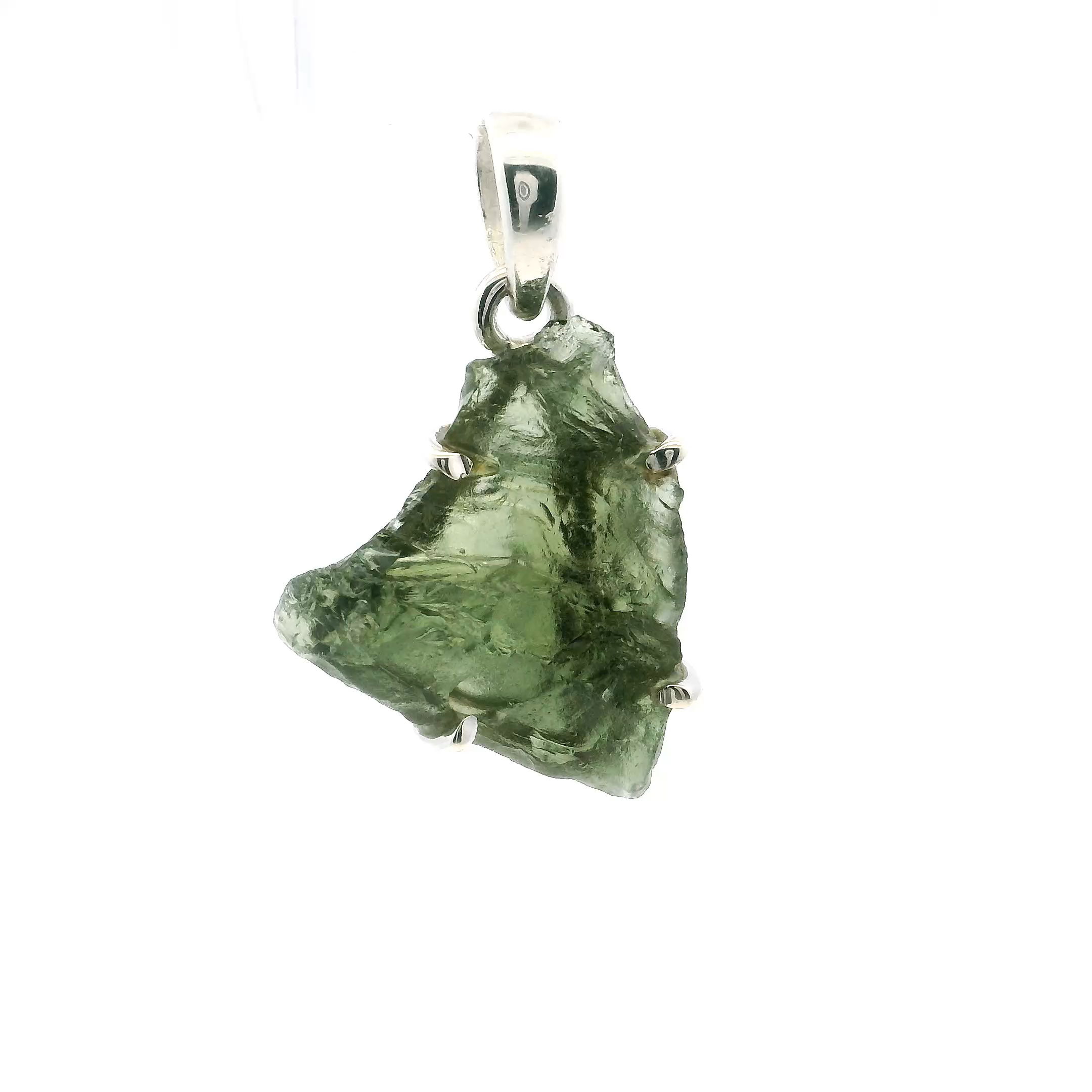 Discover the captivating allure of our Moldavite Pendant, featuring a striking shark fin-inspired freeform design. Masterfully prong set in lustrous 925 sterling silver, this unique piece highlights an authentic Moldavite gemstone—renowned for its deep green hue and extraterrestrial origin. Each pendant is one of a kind, offering both visual intrigue and powerful metaphysical resonance.Balancing raw beauty with refined craftsmanship, this pendant is a perfect addition to any collection of meaningful jewelry. Whether gifted or kept as a personal talisman, it radiates modern elegance and cosmic mystique, making a bold yet sophisticated statement. Moldavite Pendant - Shark Fin Freeform Prong Set in 925 Sterling Silver