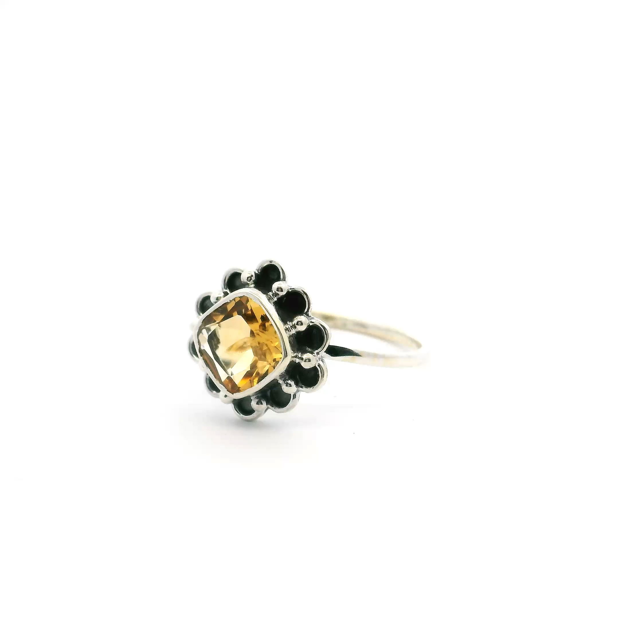 Elevate your style with this stunning Citrine Ring, featuring a faceted square citrine gemstone elegantly bezel set in 925 sterling silver. A unique round flower design surrounds the vibrant stone, adding a whimsical, feminine touch that makes it perfect for any occasion. Crafted for a comfortable fit in size 10, this ring is a radiant addition to any jewelry collection. Celebrate sophistication and vibrant color with this exquisite piece—ideal as a thoughtful gift or a joyful indulgence. Citrine Ring - Faceted Square with Round Flower Design Bezel Set in 925 Sterling Silver sz10