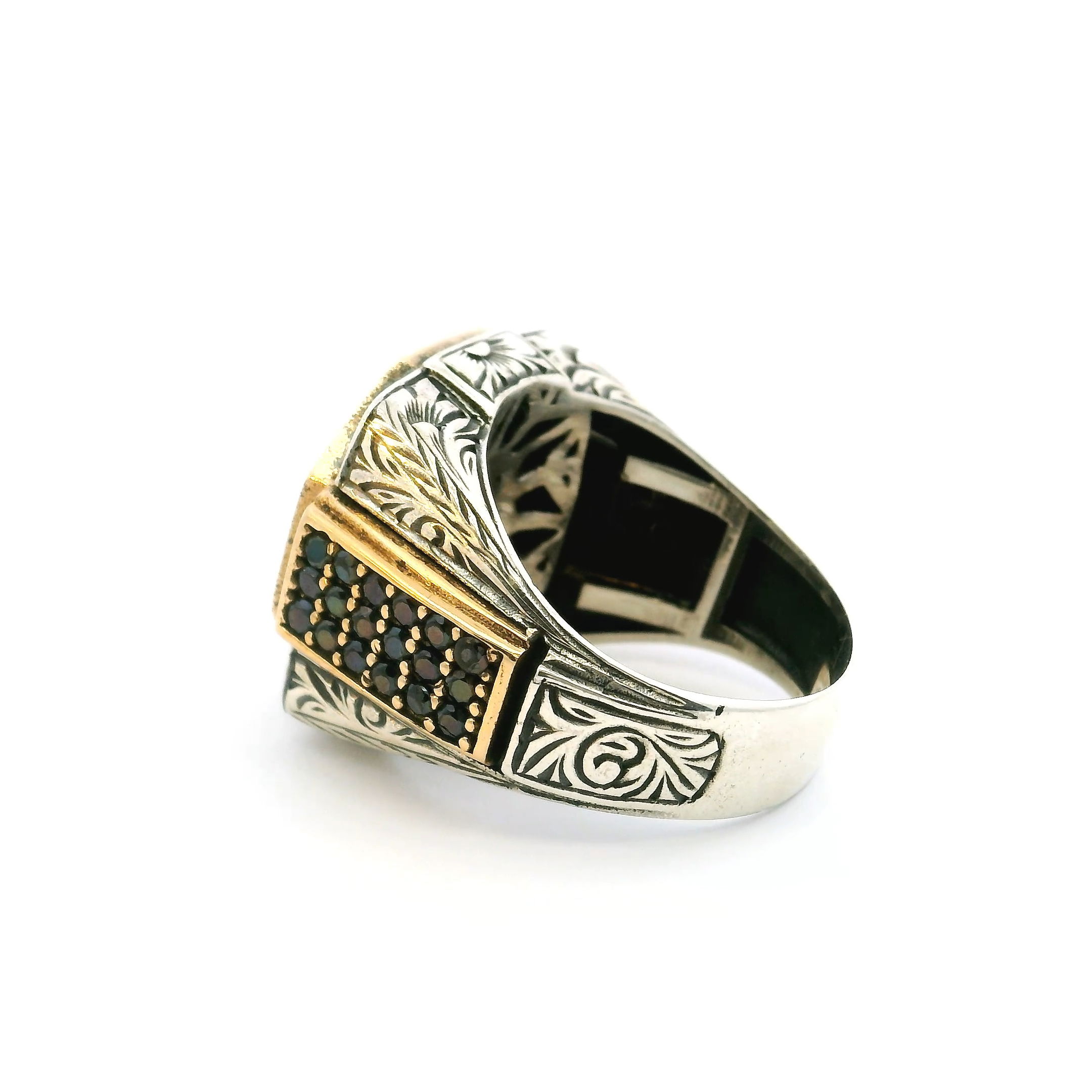 Own the room with this Garnet Ring, where fierce crimson meets sharp modern design. A brilliant faceted garnet commands attention, encased in a bold bezel and surrounded by an edgy hexagonal halo of midnight-black nanostones that inject attitude and mystery. The band continues the story with finely set black nanostones, crafting a textured contrast against the glowing gold vermeil and solid sterling silver base. Sized at 12, this ring is more than jewelry—it’s a statement of power, passion, and unapologetic style for the man who refuses to blend in. Garnet Ring - Faceted Round Bezel Set with Single Row Pave Black Nanostones in Hexagon & Black Nanostones on Both Sides of Band in Gold Vermeil over 925 Sterling Silver sz12