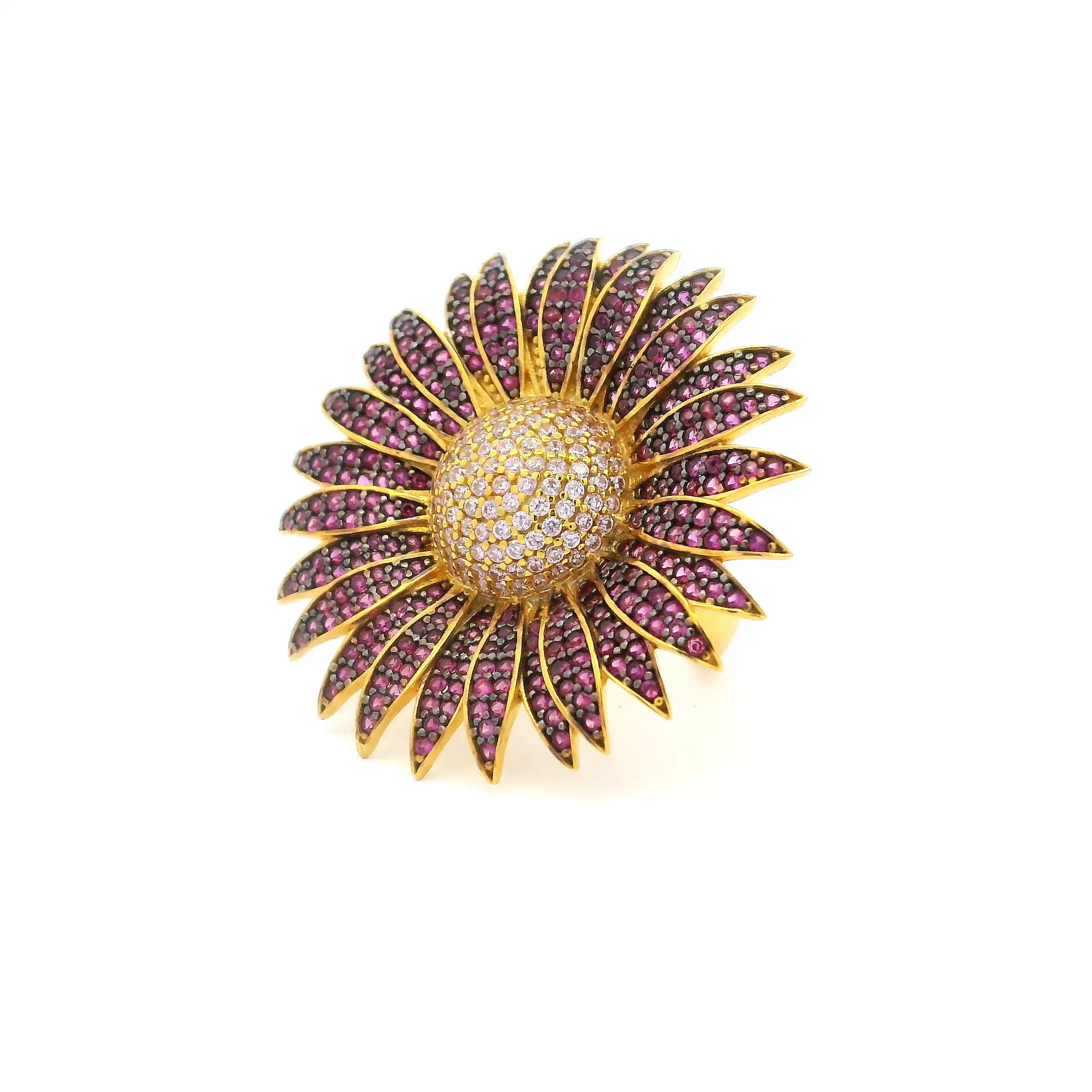 Radiate vibrant elegance with the Nanostone Sunflower Ring, a dazzling burst of color and craftsmanship. Set in lustrous gold vermeil over solid 925 sterling silver, this size 7 ring features fuchsia and pink nanostones arranged in a brilliant floral silhouette, echoing the joyful energy of a sunflower in full bloom. Each stone catches the light with fiery sparkle, blending playful femininity with refined design. Whether worn solo or stacked for extra flair, this piece is a bold celebration of modern beauty and a standout addition to any jewelry collection. Nanostone Sunflower Ring - Fuchsia & Pink Nanostones in Gold Vermeil with 925 Sterling Silver sz7