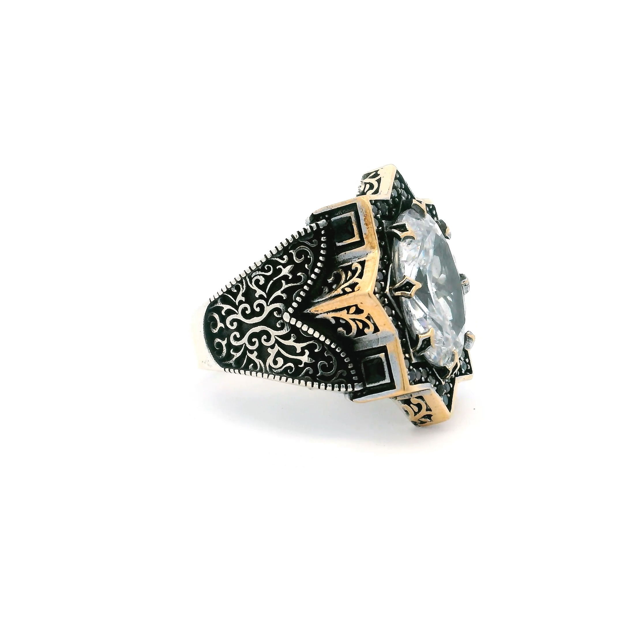 Discover bold sophistication with the Quartz Ring, featuring a faceted oval quartz expertly prong-set within a dramatic starburst design. A single row of pave-set black nanostones adds striking contrast, amplifying the stone’s natural allure. Intricate side swirls and delicate beadwork enhance the artistry, all finished in rich gold vermeil over a solid 925 sterling silver band. Sized at 10.75, this men’s ring combines contemporary edge with timeless elegance, making it a standout piece for any refined jewelry collection. Quartz Ring - Faceted Oval Prong Set in Star Design with Single Row Pave Black Nanostones & Side Swirl & Bead Details in Gold Vermeil with 925 Sterling Silver sz10.75