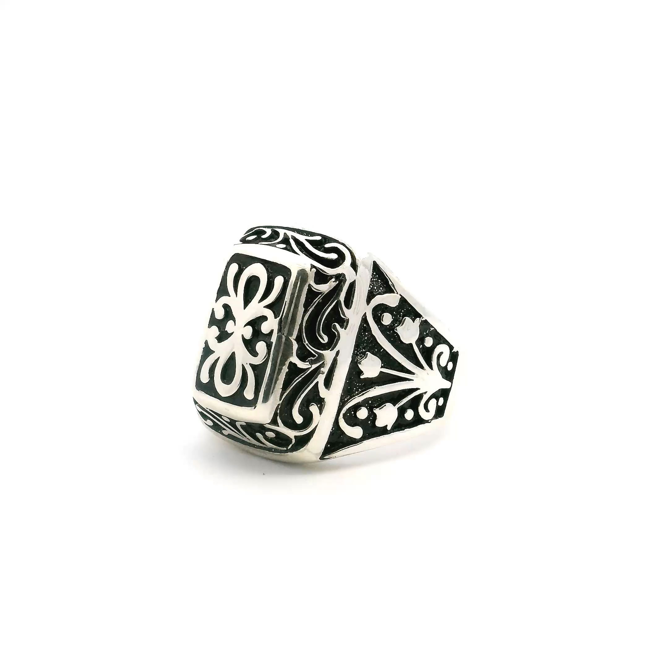 Command attention with this bold Sterling Silver Ring, designed in genuine 925 sterling silver and sized at 10.5 for a comfortable, substantial fit. A raised rectangular face anchors the design, adorned with intricate swirling engravings and a refined floral motif that lends an artisan, vintage-inspired edge. Rugged yet elegant, this ring balances craftsmanship and character—ideal for everyday confidence or adding polish to formal looks. A standout piece for the man who values detail, history, and unmistakable style. Sterling Silver Ring - Raised Rectangle with Swirl & Flower Detail in 925 Sterling Silver sz10.5