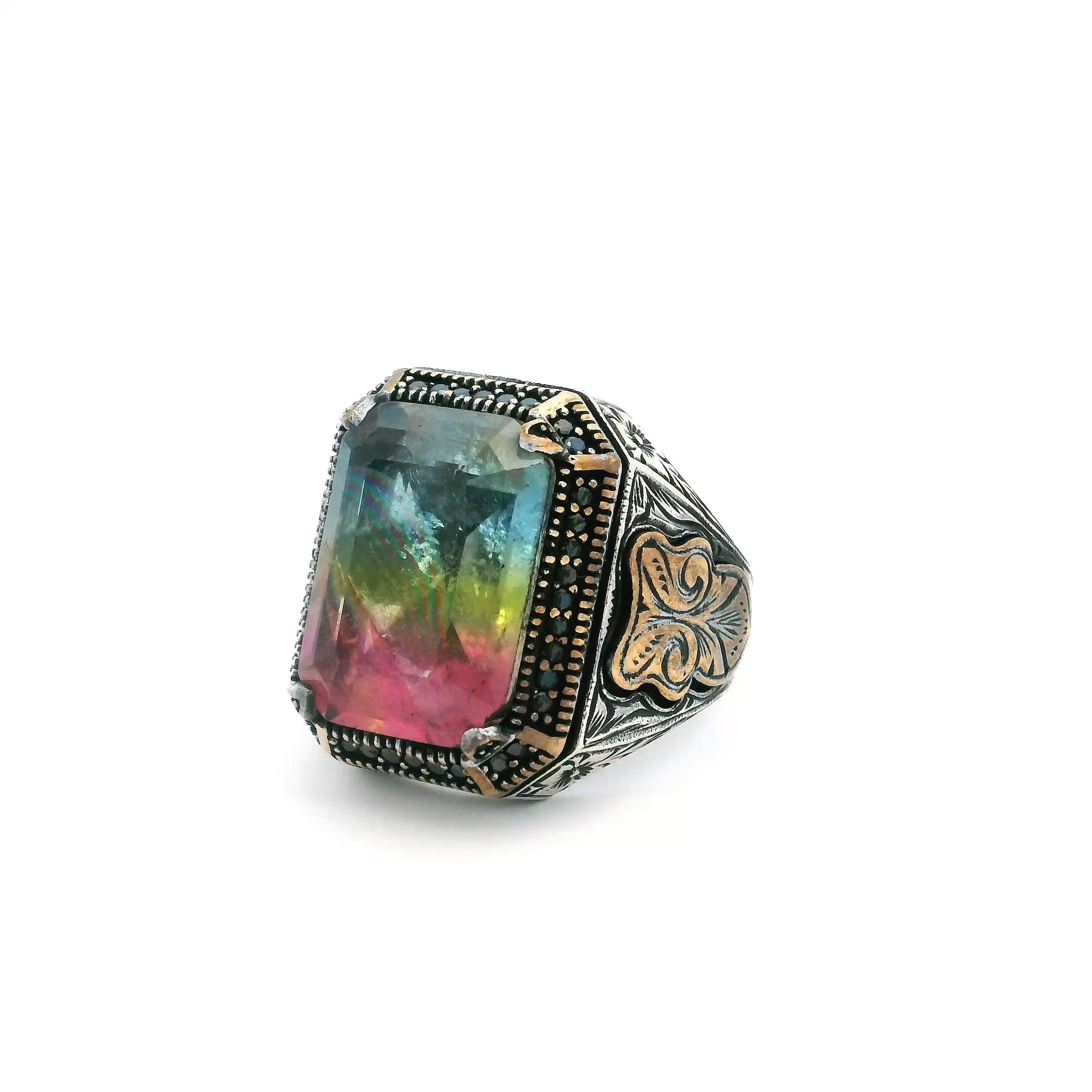 Turn heads with this bold and vibrant Tourmaline Doublet Ring, a striking fusion of color and craftsmanship. At its center, a faceted doublet gleams with layered hues of blue, yellow, and pink tourmaline—each shift of light revealing a new dimension of brilliance. Framed by a sleek row of black pavé nanostones, this size 11.75 ring is expertly set in solid 925 sterling silver with rich gold vermeil accents that elevate its modern edge. Designed for those who appreciate daring elegance, this ring makes an unforgettable statement—whether worn daily or reserved for standout occasions. Tourmaline Doublet Ring - Faceted Blue Yellow & Pink Tourmaline Doublet with Single Row Pave Black Pave Nanostones Prong Set in 925 Sterling Silver with Gold Vermeil Accents sz11.75