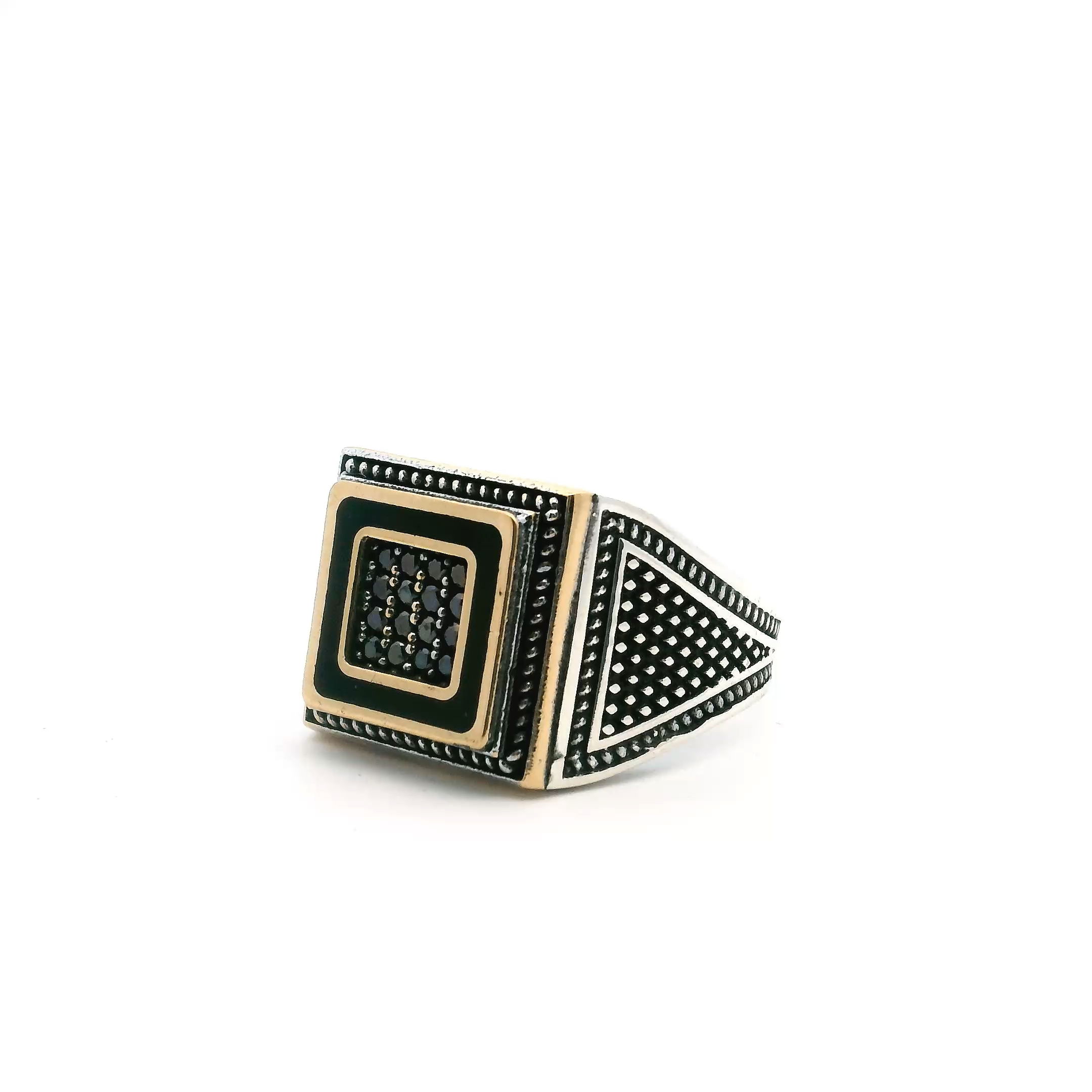 Elevate your style with this striking Black Onyx Ring, expertly crafted for the modern man. Sixteen faceted black onyx nanostones shimmer with depth and intrigue, meticulously hand-set within a bold gold vermeil square bezel. Classic rope accents frame the design, contrasting elegantly with the solid 925 sterling silver band. Sized at 12.5, this ring marries luxurious materials with timeless elegance—ideal for making a statement or refining everyday wear. A piece that embodies confidence, strength, and enduring style. Black Onyx Ring - 16 Faceted Black Onyx Round Nanostones Set in Gold Vermeil Square with Rope Details in 925 Sterling Silver sz12.5