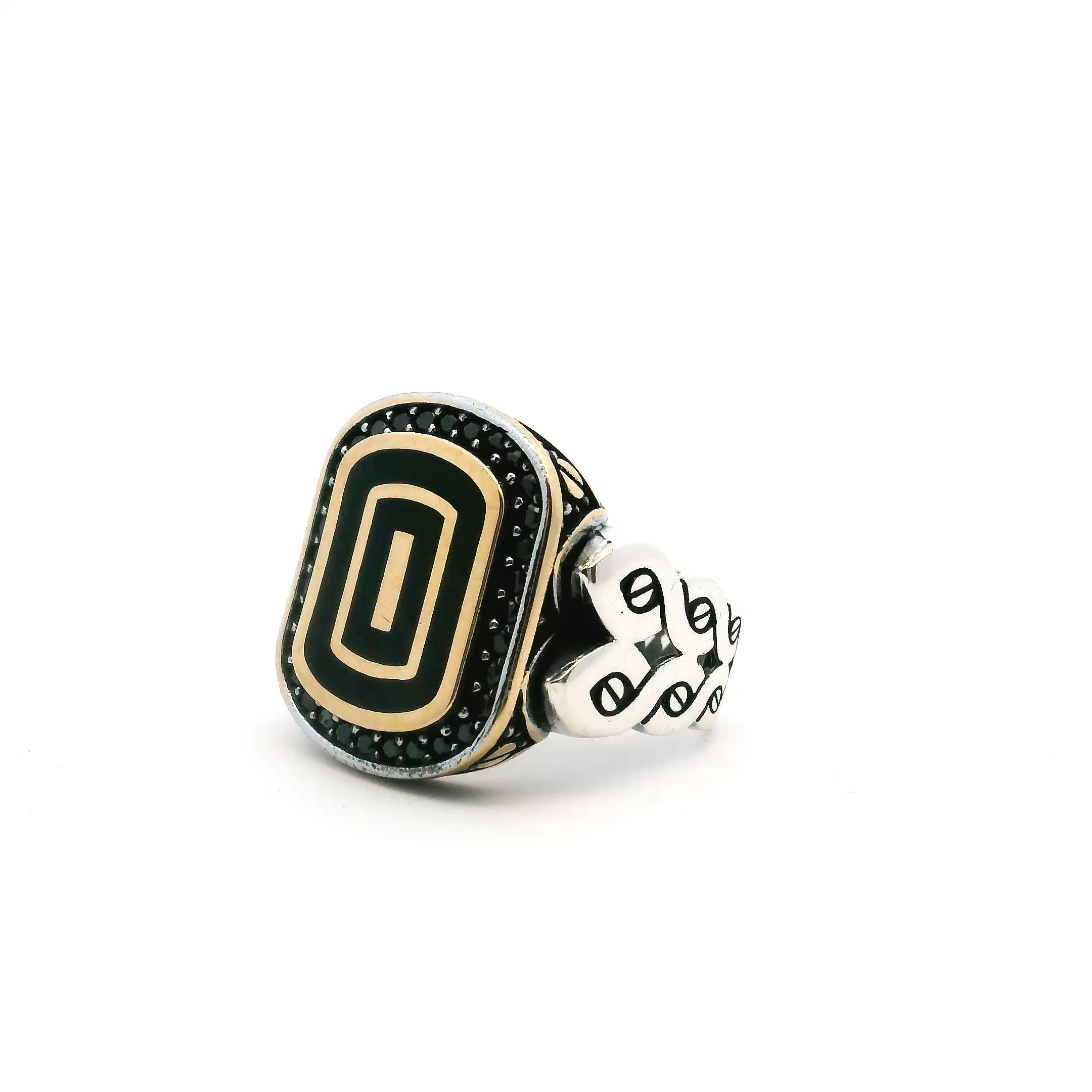 Bold sophistication meets timeless elegance in this Black Onyx Ring, designed for anyone who appreciates distinctive detail. The centerpiece is a striking, rounded rectangle flat black onyx, bezel set and framed by a single row of pavé black nanostones for subtle shimmer. Glimmering gold vermeil accents lend a luxurious touch to the setting, while the expertly braided band in solid 925 sterling silver creates a unique, dimensional silhouette. Sized at 9.75, this ring blends edginess with classic refinement—perfect as a statement piece or an everyday signature. Black Onyx Ring - Rounded Rectangle Flat with Single Row Pave Black Nanostones Bezel Set with Gold Vermeil Accents & Braided Band in 925 Sterling Silver sz9.75