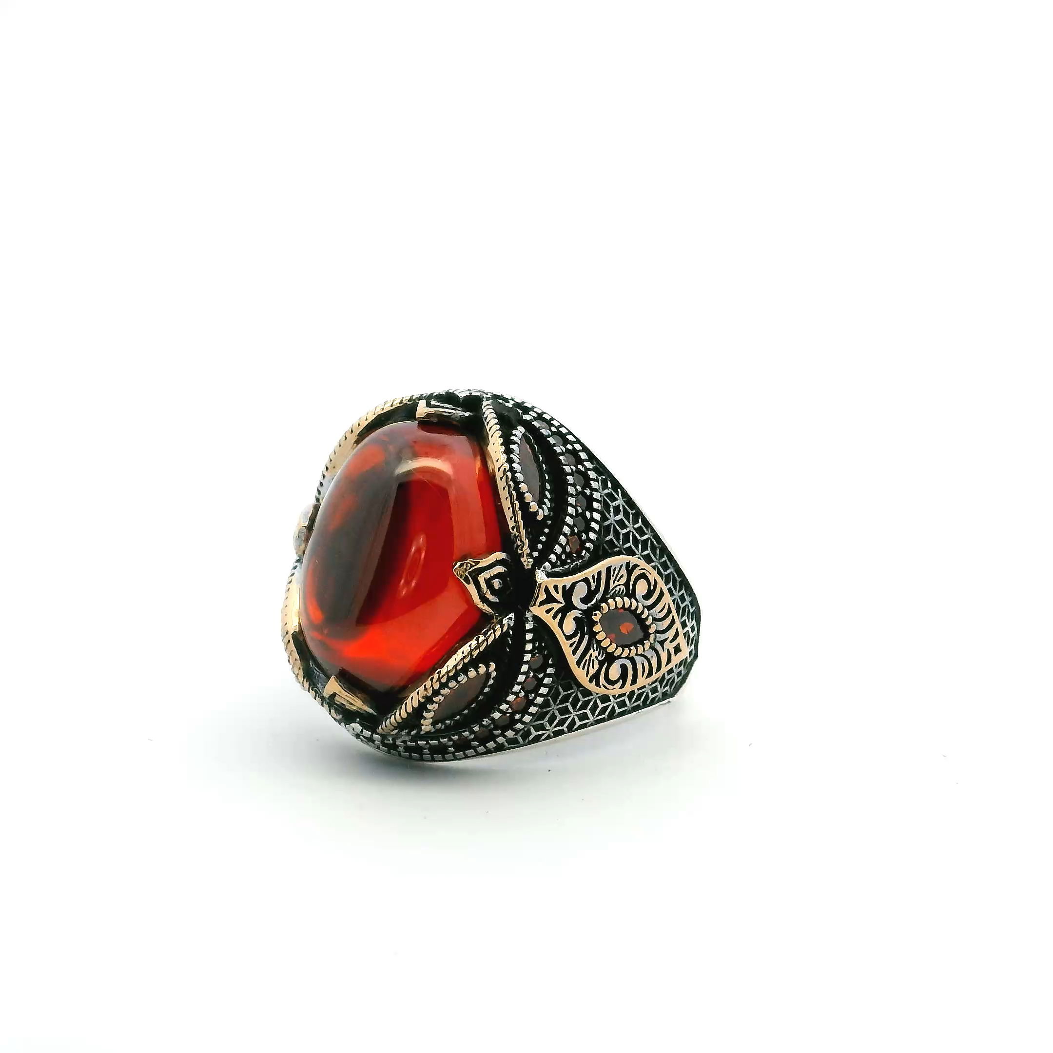 The Red Nano Stones Ring is a striking fusion of fire and form, featuring a bold oval glass cabochon encircled by vivid red nanostones and faceted ovals. Crafted in gold vermeil over solid 925 sterling silver, every detail is precision-set to highlight its bold design. Sized at 11.5, it offers a refined yet powerful presence—modern luxury with an edge. Red Nano Stones Ring - Oval Glass Cabochon Prong Set in Gold Vermeil with Red Nanostones & Faceted Red Ovals in 925 Sterling Silver sz11.5