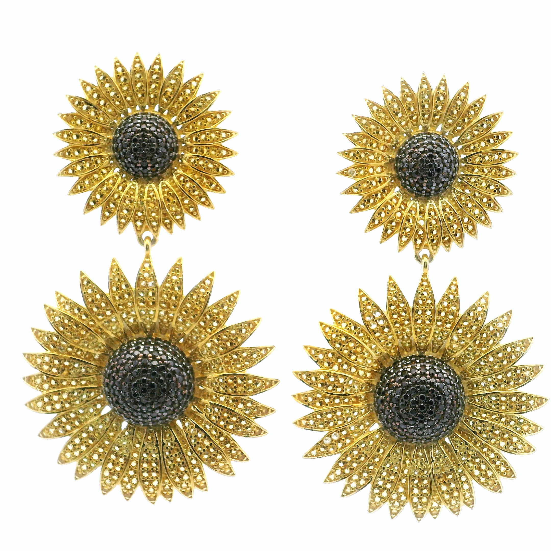 Radiate warmth and joy with our Sunflower Nanostone Dangle Earrings, featuring double sunflower charms adorned with brilliant yellow and brown nanostones that echo the glow of a sun-drenched bloom. Crafted in gold vermeil over 925 sterling silver, each petal is finely detailed for a luxurious yet nature-inspired finish. Lightweight and full of movement, these earrings bring effortless elegance to both everyday outfits and special occasions. A perfect blend of charm and craftsmanship, they make a thoughtful gift or a vibrant addition to your personal collection. Sunflower Nanostone Dangle Earrings - Double Sunflowers with Yellow & Brown Nanostones in Gold Vermeil over 925 Sterling Silver
