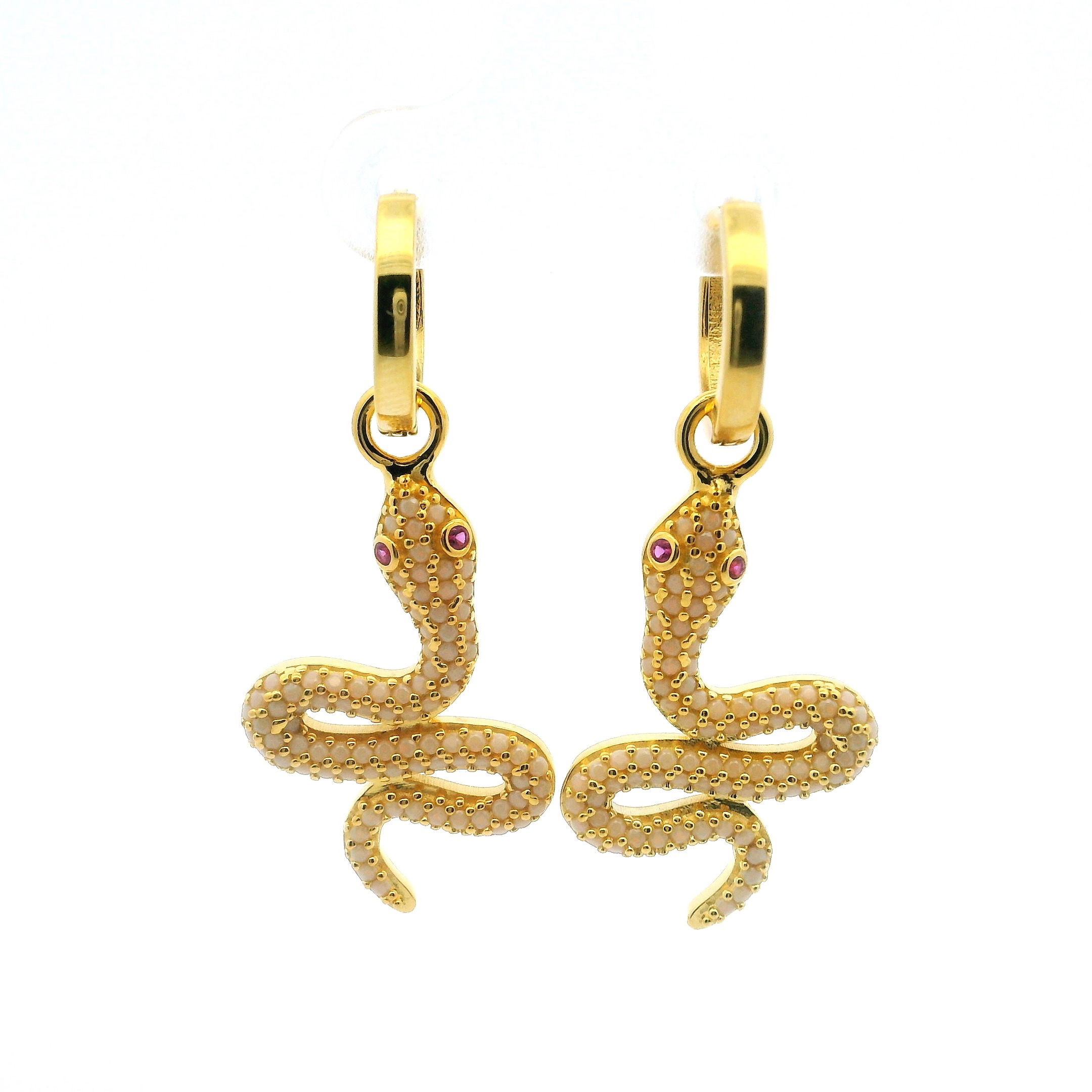Unveil your untamed elegance with these captivating Swarovski Crystal Dangle Earrings, sculpted in the form of a white snake and finished in radiant gold vermeil over 925 sterling silver. Each graceful serpent is encrusted with shimmering white nano stones and crystals, brought to life by hypnotic pink eyes that radiate allure. Lightweight and balanced for all-day wear, these earrings blend daring design with refined craftsmanship. A striking choice for the bold and stylish, they add an enchanting edge to any ensemble, transforming every glance into a statement. Swarovski Crystal Dangle Earrings - White Snake with Pink Eyes in Gold Vermeil over 925 Sterling Silver