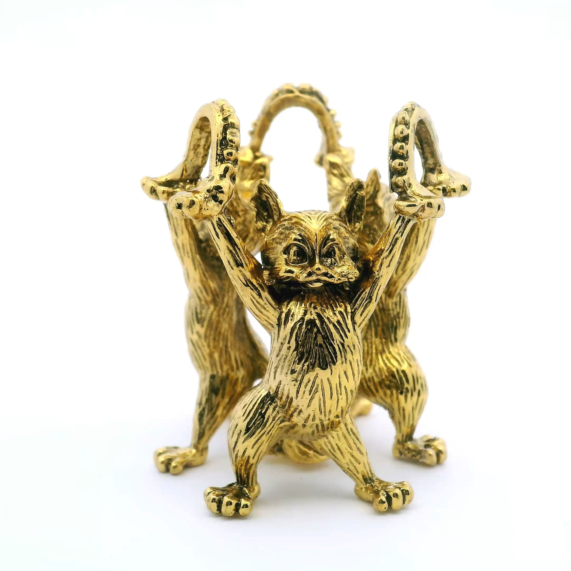 Showcase your favorite crystals and spheres with the Casted Base Metal 3 Cats Sphere Stand in gleaming gold. This whimsical display features three intricately sculpted cats, their elegant forms entwined to cradle stones or orbs up to 2.5 inches in diameter. Crafted from sturdy casted metal and finished in a radiant golden hue, it adds both charm and stability to any display. A delightful blend of function and feline-inspired design, it’s the perfect accent for collectors, cat lovers, or anyone looking to add a playful yet refined touch to their space. Casted Base Metal 3 Cats Sphere Stand - Gold