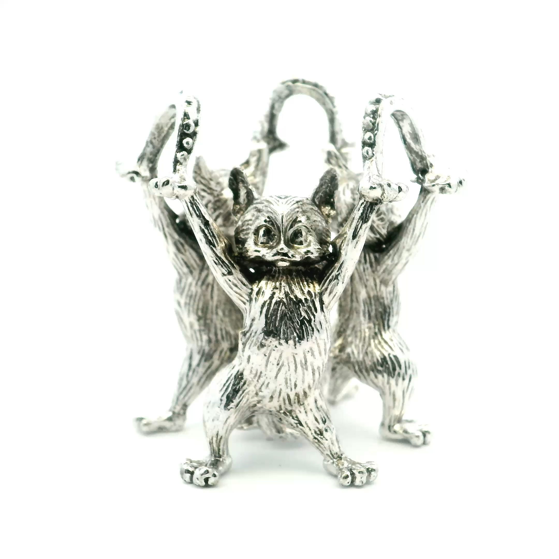 Elevate your crystal spheres or cherished collectibles with the Casted Base Metal 3 Cats Sphere Stand in elegant silver. Featuring three gracefully sculpted cats with entwined tails for added balance and charm, this intricately cast metal stand blends whimsical design with refined craftsmanship. Ideal for holding spheres, eggs, or small sculptures, it brings a unique artistic accent to shelves, altars, or display cases. A perfect gift for cat lovers, collectors, or those with a taste for the unusual, this silver-toned piece adds personality and poise to any space. Casted Base Metal 3 Cats Sphere Stand - Silver