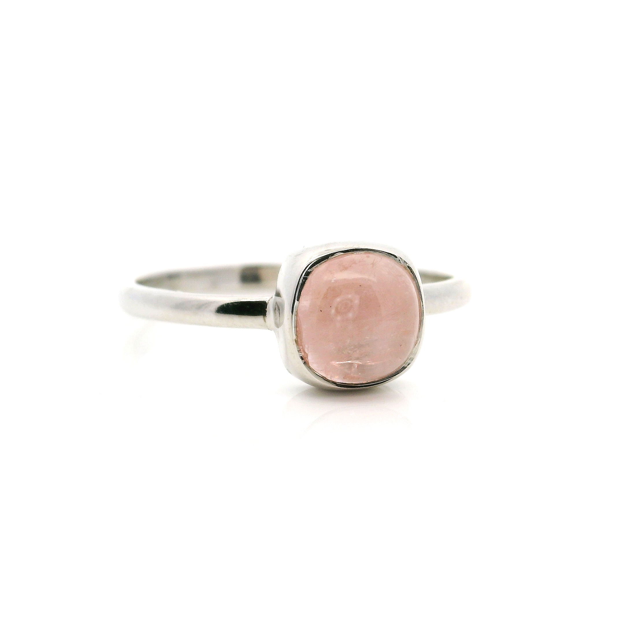 Elevate your style with this stunning Morganite ring, featuring a captivating square cabochon morganite gemstone elegantly bezel set in gleaming 925 sterling silver. Designed in a minimalist fashion, this size 9 women's ring highlights the subtle blush hues of morganite, making it perfect for both everyday wear and special occasions. The smooth, clean lines and classic craftsmanship ensure lasting beauty and versatile appeal for any jewelry collection. Treat yourself or someone special to the timeless elegance of morganite with this exquisite sterling silver ring. Morganite Ring - Square Cabochon Bezel Set in Simple 925 Sterling Silver sz9