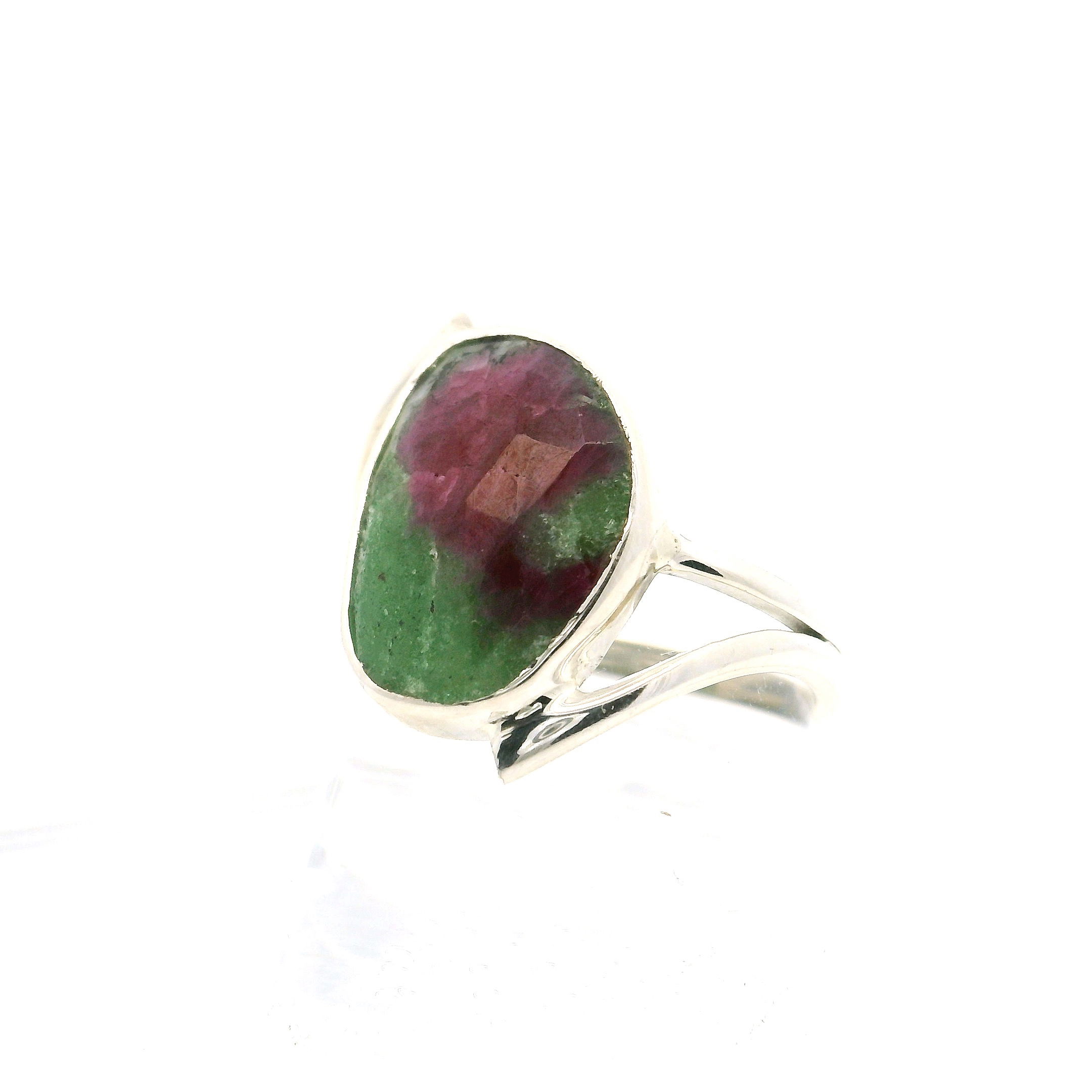 Elevate your style with this striking Ruby Zoisite ring, featuring a unique faceted freeform gemstone bezel set in gleaming 925 sterling silver. The double offset band design brings modern sophistication, perfectly complementing the rich fusion of deep ruby reds and vibrant green zoisite in the stone. Expertly handcrafted for a comfortable fit in size 7, this stunning piece adds a touch of bold elegance to any look. Ideal for collectors and fashion-forward women, it’s a captivating statement ring for everyday wear or special occasions. Ruby Zoisite Ring - Faceted Freeform Bezel Set onDouble Offset Band in 925 Sterling Silver sz7