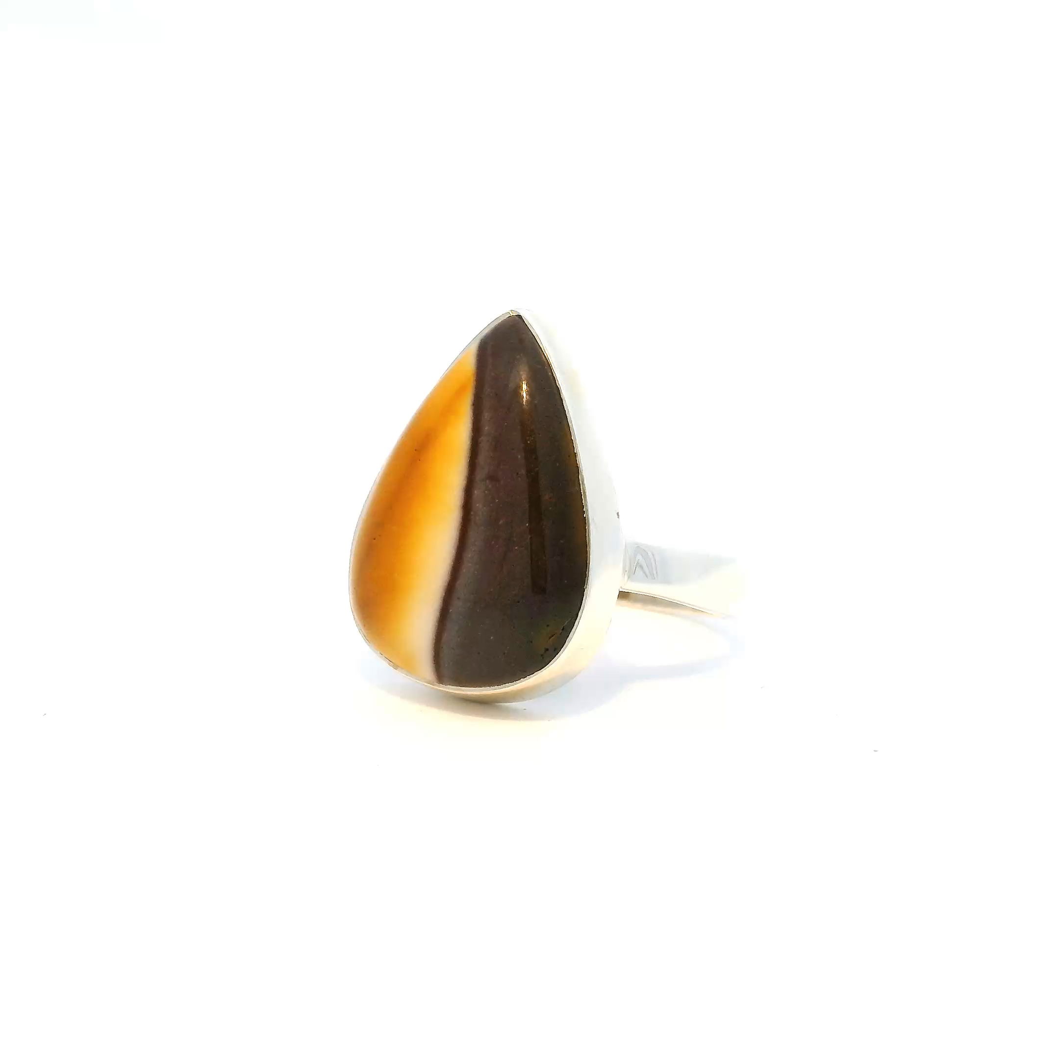 Embrace bold sophistication with this striking Mookaite Ring, showcasing a vertically set pear-shaped cabochon split in vivid yellow and deep plum-purple. The natural color contrast is both earthy and eye-catching, framed in a clean, minimalist bezel of solid 925 sterling silver. Sized at 8, this one-of-a-kind piece makes a refined yet expressive statement—perfect for those drawn to rare gemstones and timeless design. Mookaite Ring - Pear Cabochon with Half Yellow & Half Dark Purple in Vertical Split Bezel Set in Simple 925 Sterling Silver sz8