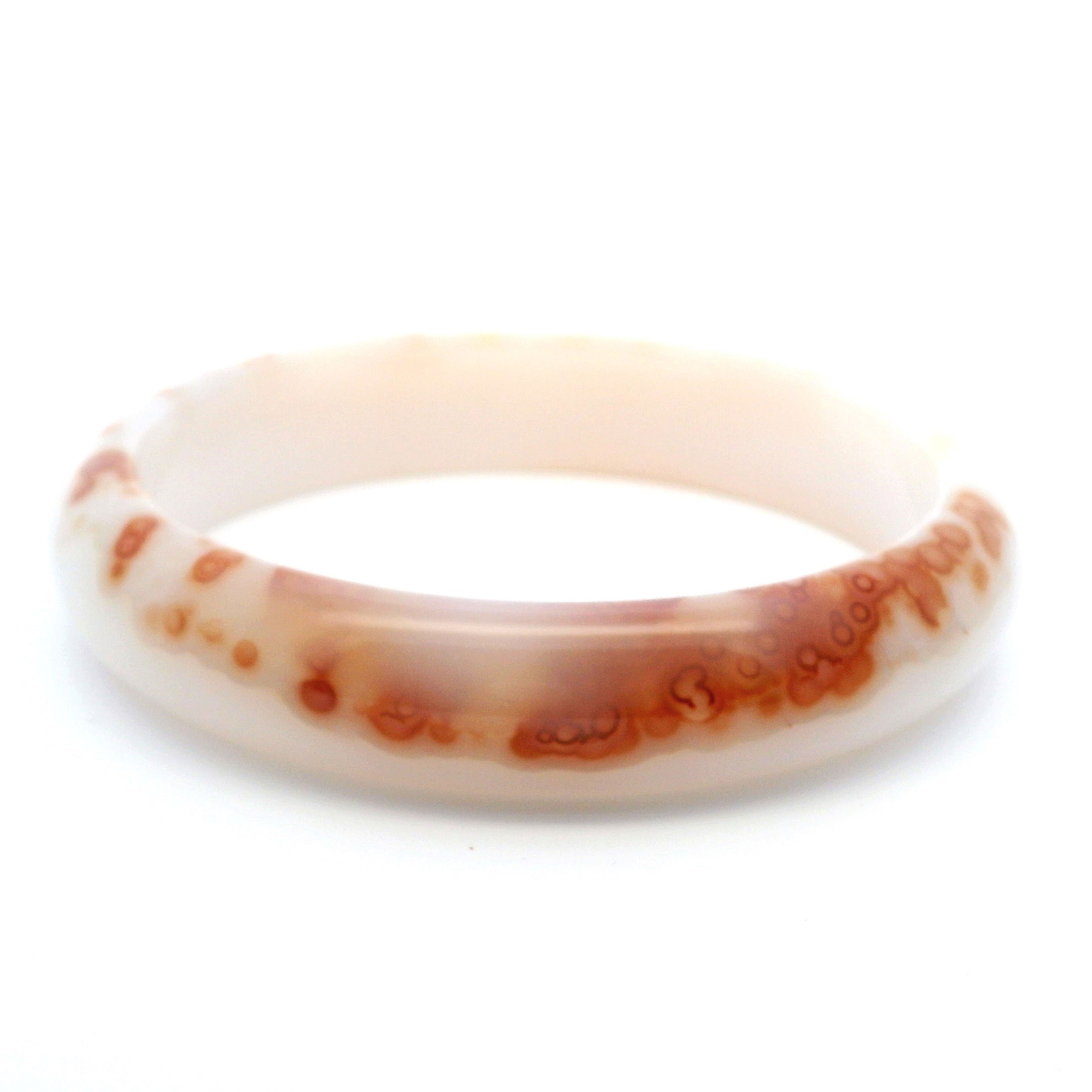 Elevate your style with the Carnelian Bracelet Bangle, where polished snow white agate accents harmonize with vibrant carnelian stones known for igniting confidence and creativity. Hand-strung for durability and comfort, this elegant piece balances fiery energy and calming purity, making it a versatile addition to any jewelry collection. Perfect for layering or wearing solo, it brings a meaningful burst of color and inspiration to everyday wear or special occasions. Carnelian Bracelet Bangle with Snow White Agate