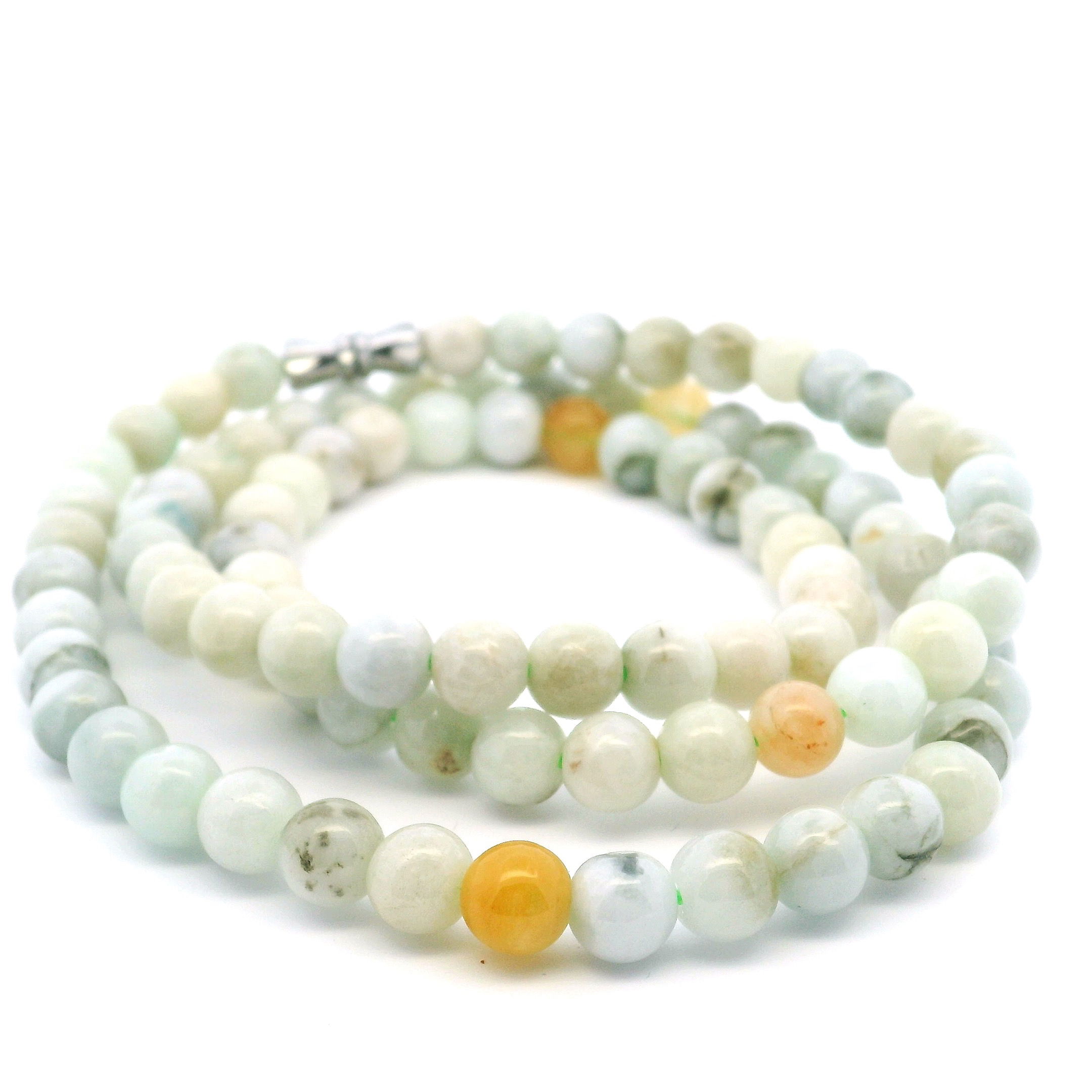 Elevate your style with this exquisite Nephrite Jade Beaded Necklace, showcasing lustrous 6mm round jade beads expertly strung for timeless elegance. Completed with a secure twist closure, this piece blends classic beauty with everyday wearability. Known for its rich green hues and symbolic harmony, Nephrite Jade brings balance and good fortune, making this necklace a meaningful addition to any collection or a thoughtful gift. Perfect worn alone or layered, it suits every occasion with effortless grace. Nephrite Jade Beaded Necklace with Twist Closure - 6mm Rounds