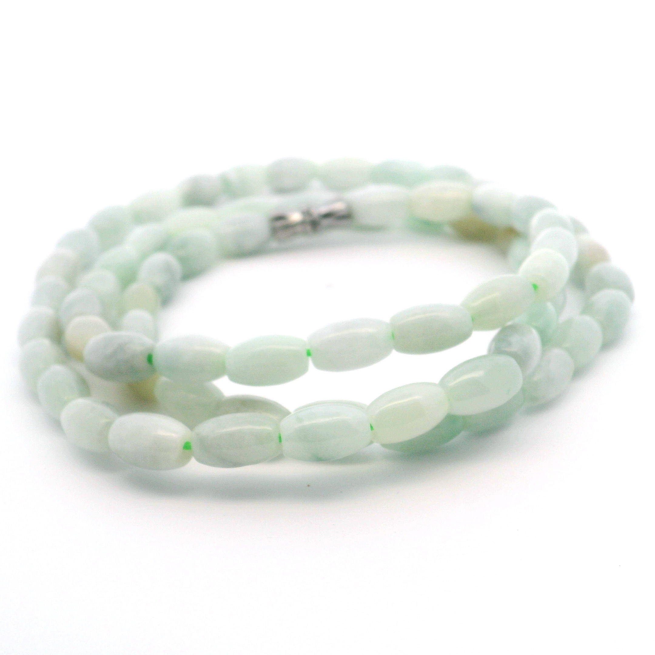 Elevate your style with the Nephrite Jade Beaded Necklace, handcrafted from smooth barrel-shaped beads that glow with natural elegance. Each vibrant green jade bead is polished to reveal unique variations, making every necklace truly one of a kind. Finished with a secure twist closure for effortless wear, this piece harmonizes timeless beauty with the cherished symbolism of jade—bringing balance and sophistication to any ensemble. Perfect as a meaningful gift or a standout addition to your collection. Nephrite Jade Beaded Necklace with Twist Closure - Barrel Beads
