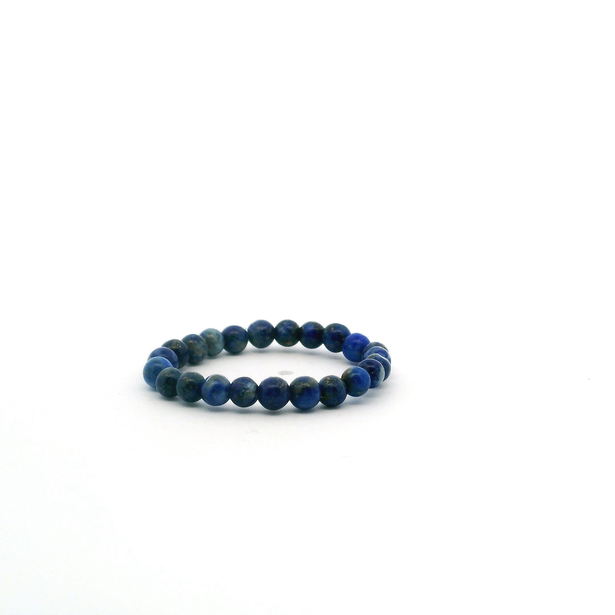 Elevate your style with the Lapis Lazuli Beaded Ring, handcrafted with 3mm smooth round beads showcasing the stone’s rich midnight blue tones and signature golden pyrite flecks. This minimalist ring offers a celestial touch, perfect for stacking or wearing alone as a symbol of inner wisdom and timeless beauty. Lightweight, elegant, and easy to wear, it adds a refined accent to any look—ideal for daily wear, meaningful gifting, or a subtle expression of personal style. Lapis Lazuli Beaded Ring - 3mm Round