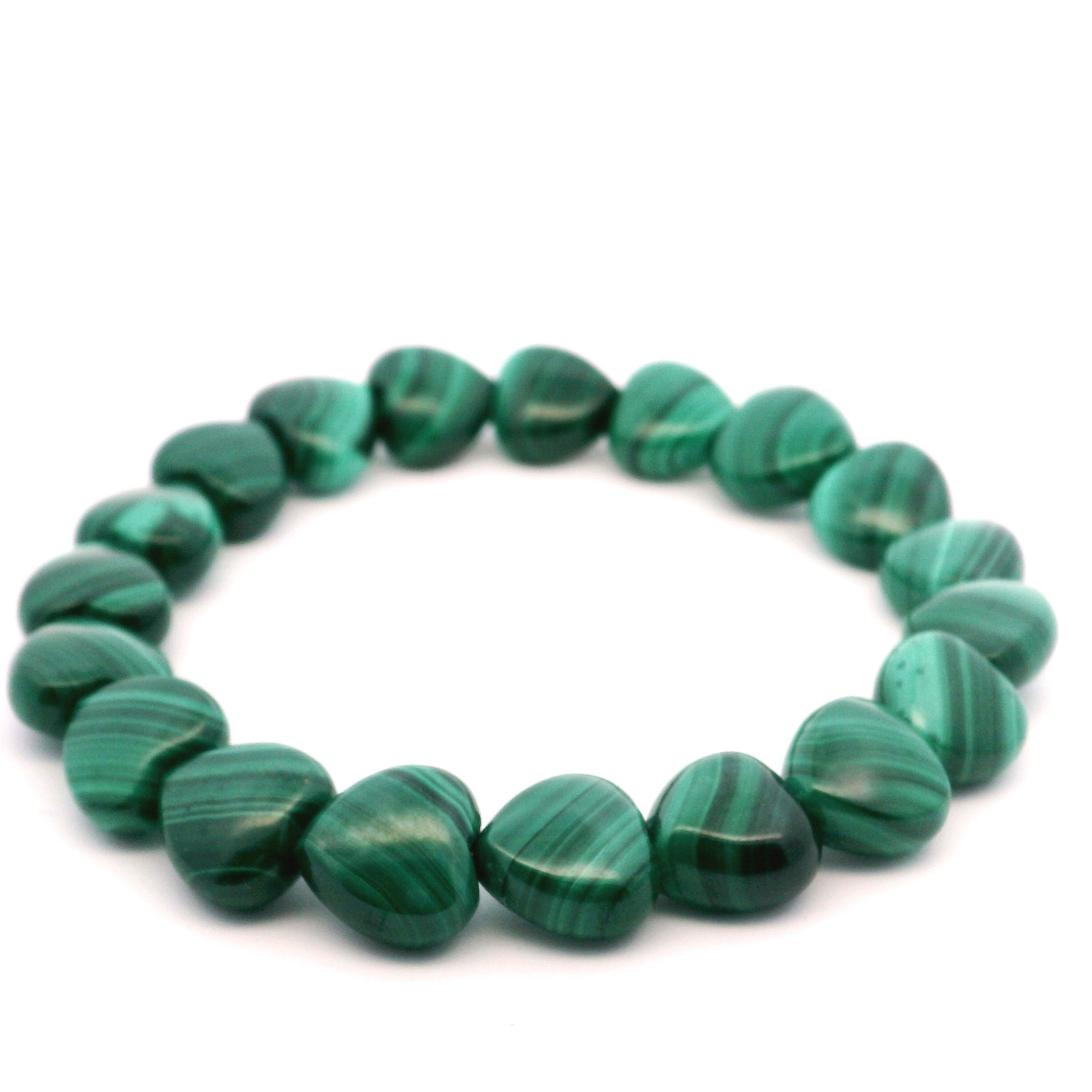 Elevate your style with the Malachite Beaded Bracelet, showcasing captivating 10x10mm heart-shaped malachite stones, each adorned with the stone’s signature deep green banding. Symbolizing transformation and protection, these polished beads are strung on a strong, flexible elastic cord for a comfortable and secure fit. Whether worn solo or layered, this bracelet brings a bold yet elegant touch to any ensemble. A timeless piece for those drawn to malachite’s powerful energy and striking beauty. Malachite Beaded Bracelet - Heart 10x10