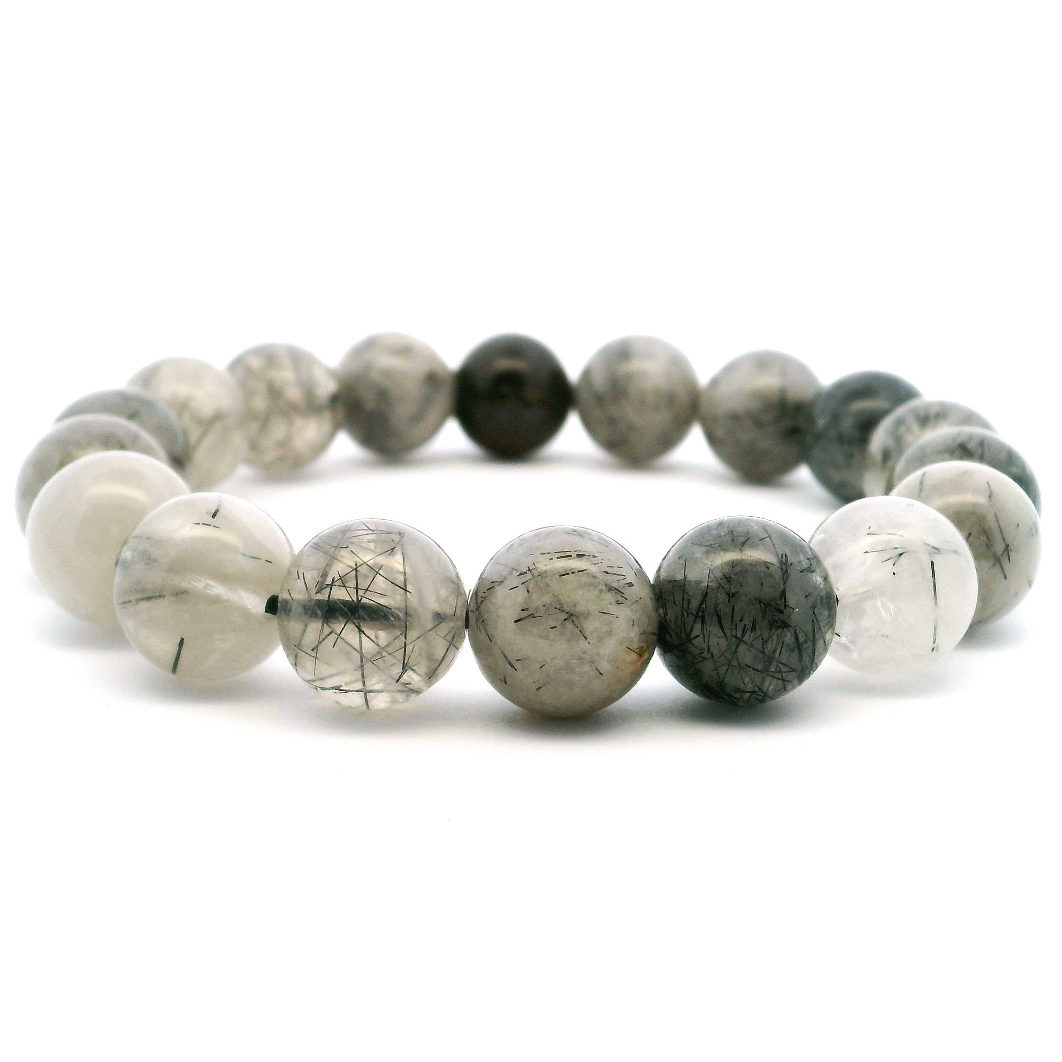 Elevate your style with our Black Tourmalated Quartz Beaded Bracelet, featuring bold 12mm round beads that captivate with unique black tourmaline inclusions suspended in clear quartz. Strung on a durable stretch cord for a comfortable fit, this bracelet blends striking beauty with grounding, protective energy. Perfect worn solo or stacked, it adds sophisticated depth to any outfit and serves as a meaningful gift or personal treasure for those drawn to natural elegance and spiritual balance. Black Tourmalated Quartz Beaded Bracelet - 12mm Rounds